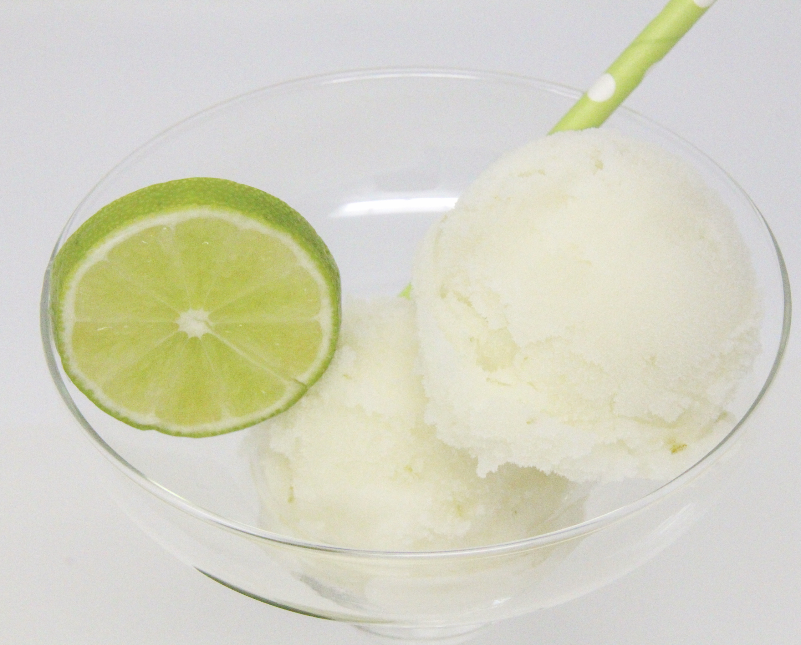 A tart-sweet lime sorbet with a kick from tequila and triple sec, this Ultimate Frozen Margarita captures the essence of summer! Recipe shared with permission granted by Meri Allan, author of THE ROCKY ROAD TO RUIN. 