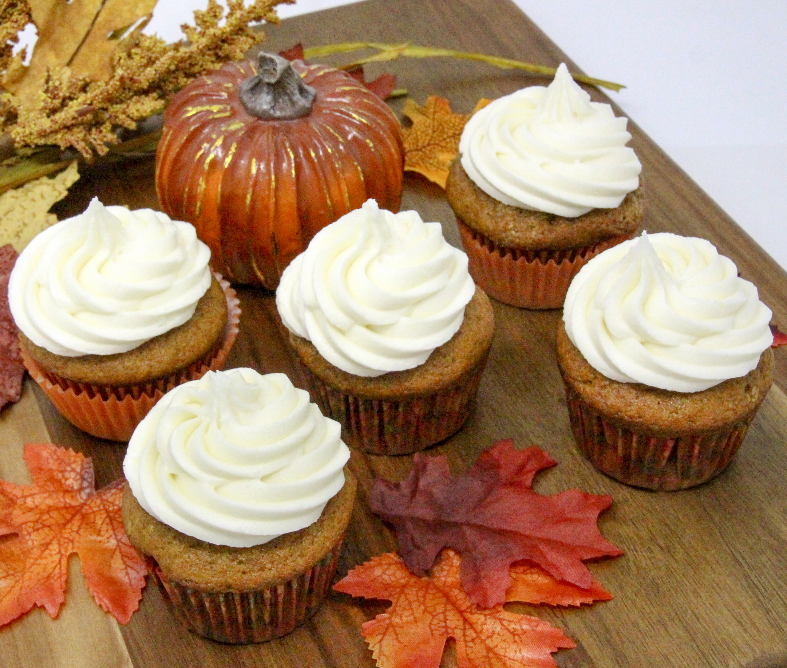 Rich and moist, the warm flavors of these Pumpkin Cupcakes with Cream Cheese Frosting hits the mark for bringing to mind chilly fall days and looking forward to jack-o-lanterns and trick-or-treaters. Recipe shared with permission granted by Krista Davis, author of MURDER OUTSIDE THE LINES.