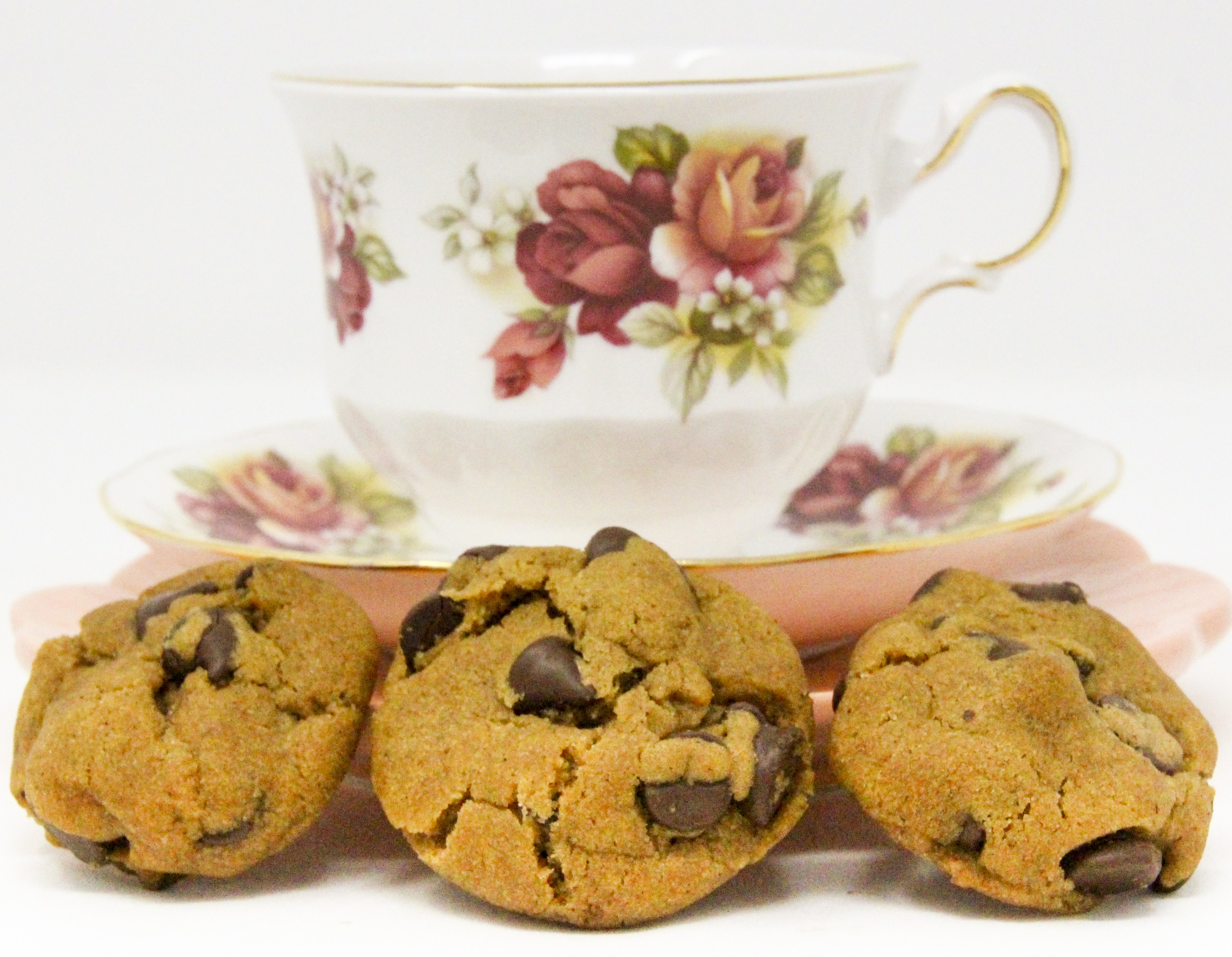 Gingerbread Chocolate Chip Cookies packs a wallop of flavor bringing to mind a cozy holiday feel. The soft gingerbread is filled with chocolate chips, so every bite is a flavor combination like none other. Recipe shared with permission granted by Debra Sennefelder, author of THE CORPSE IN THE GAZEBO.