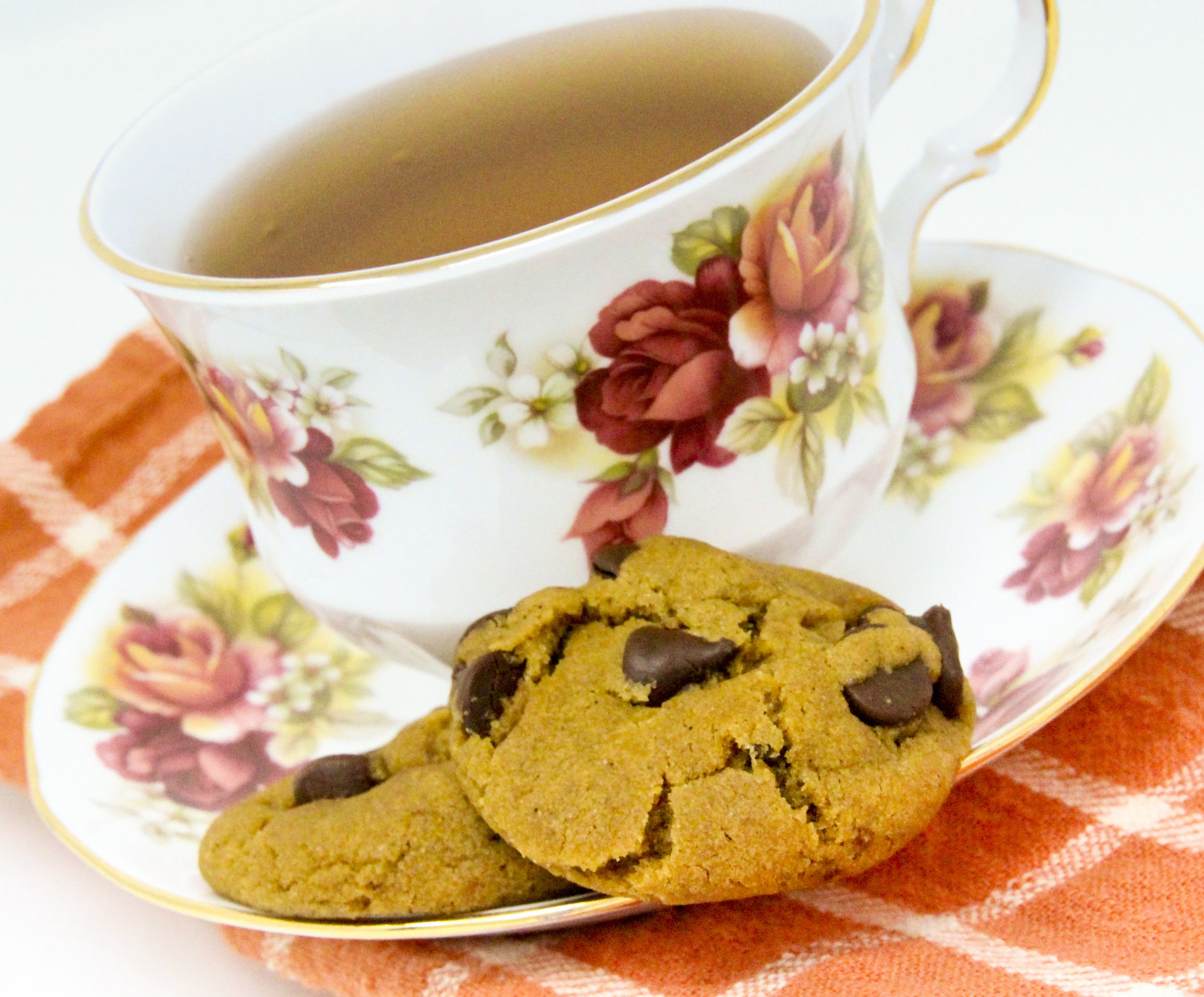 Gingerbread Chocolate Chip Cookies packs a wallop of flavor bringing to mind a cozy holiday feel. The soft gingerbread is filled with chocolate chips, so every bite is a flavor combination like none other. Recipe shared with permission granted by Debra Sennefelder, author of THE CORPSE IN THE GAZEBO.