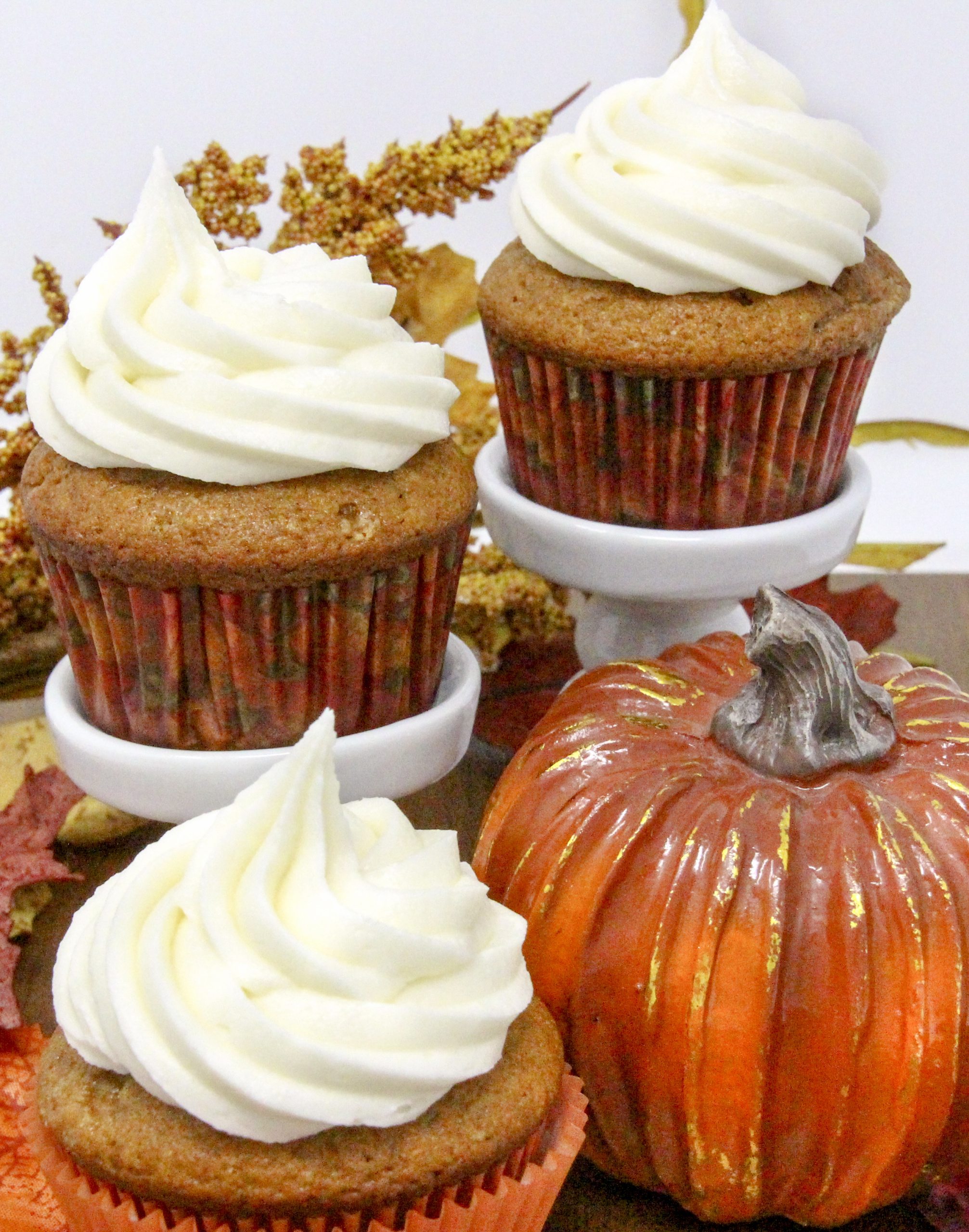Rich and moist, the warm flavors of these Pumpkin Cupcakes with Cream Cheese Frosting hits the mark for bringing to mind chilly fall days and looking forward to jack-o-lanterns and trick-or-treaters. Recipe shared with permission granted by Krista Davis, author of MURDER OUTSIDE THE LINES.