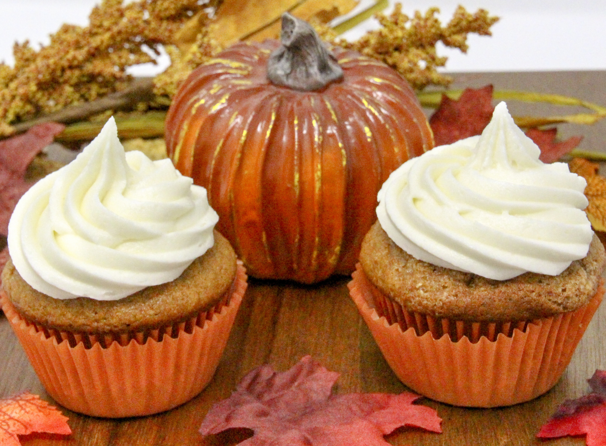 Rich and moist, the warm flavors of these Pumpkin Cupcakes with Cream Cheese Frosting hits the mark for bringing to mind chilly fall days and looking forward to jack-o-lanterns and trick-or-treaters. Recipe shared with permission granted by Krista Davis, author of MURDER OUTSIDE THE LINES.