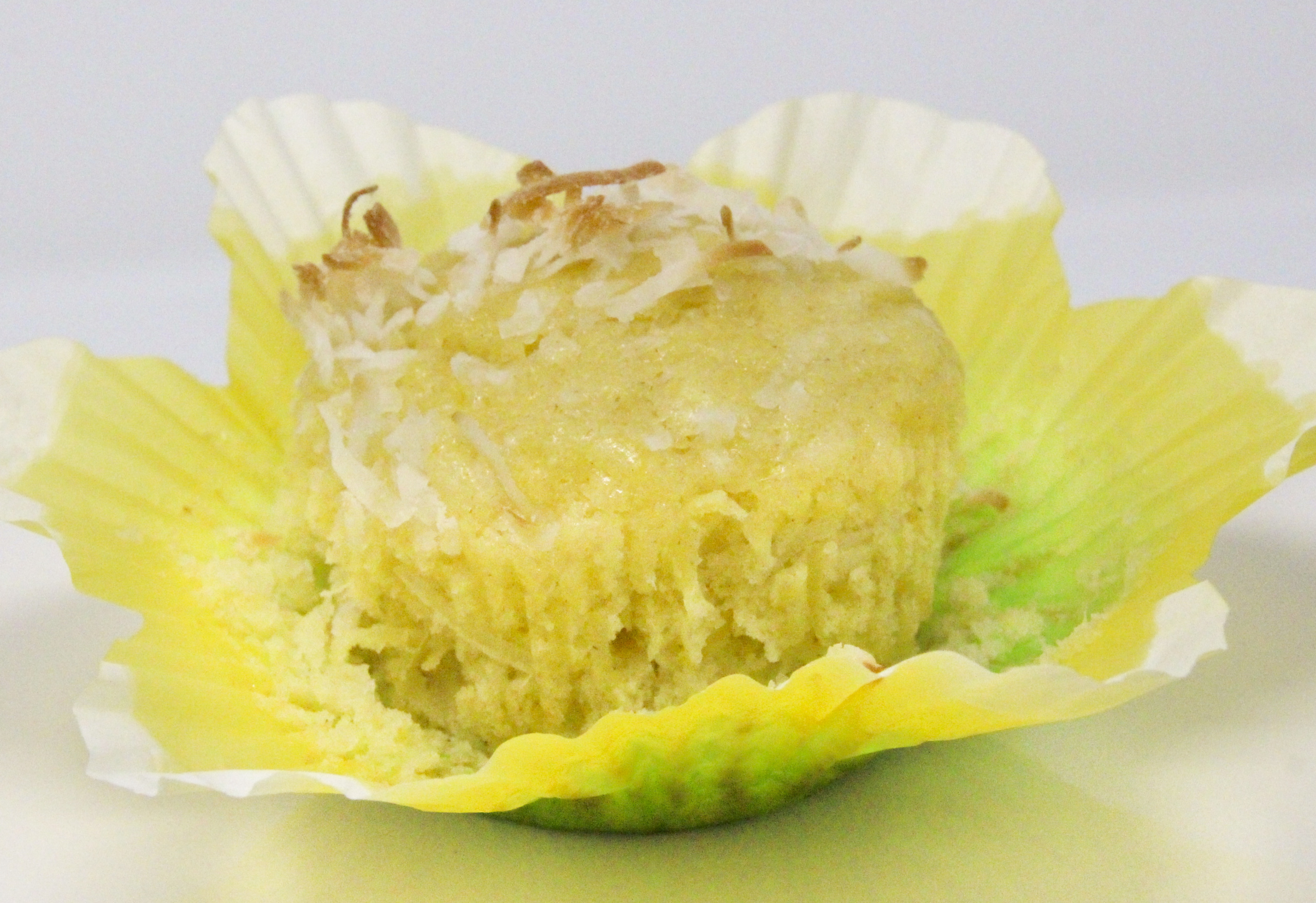 Tropical Pineapple Muffins are moist and flavorful thanks to the generous amount of pineapple. These muffins will have you dreaming of sunny days and tropical isles on chilly winter mornings! Recipe shared with permission granted by Kim Davis, contributing author for The Secret Ingredient: The Mystery Writers' Cookbook.