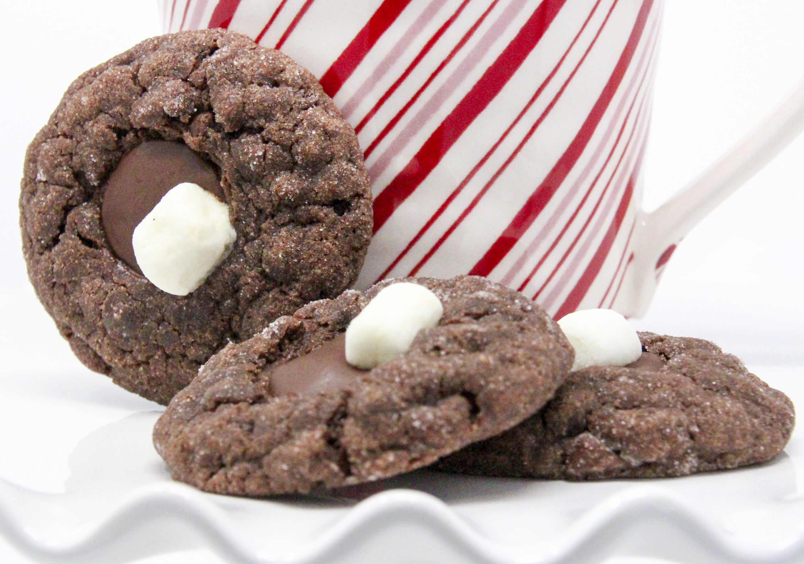 Rich chocolate cookies are topped with a chocolate wafer and a mini marshmallow. With caramel undertones from brown sugar and a bit of coffee to enhance the chocolate flavor, these cookies are sure to be a hit with Santa and his merry little elves! Recipe from FROSTED YULETIDE MURDER by Kim Davis.