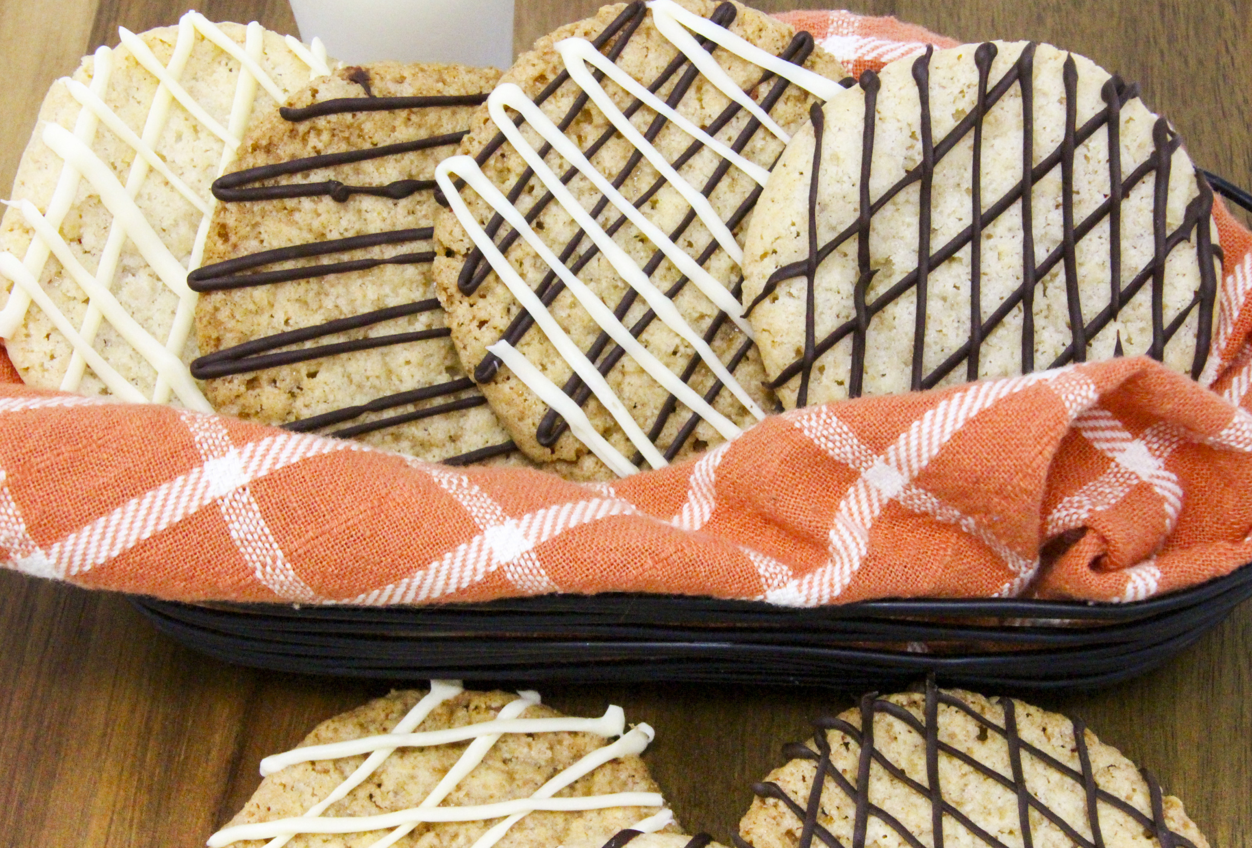 Thin and crispy on the edges, yet a bit chewy on the inside, these Lacy Oatmeal Cookies with chocolate drizzle makes a simple cookie irresistible. Recipe from FROSTED YULETIDE MURDER by Kim Davis. 