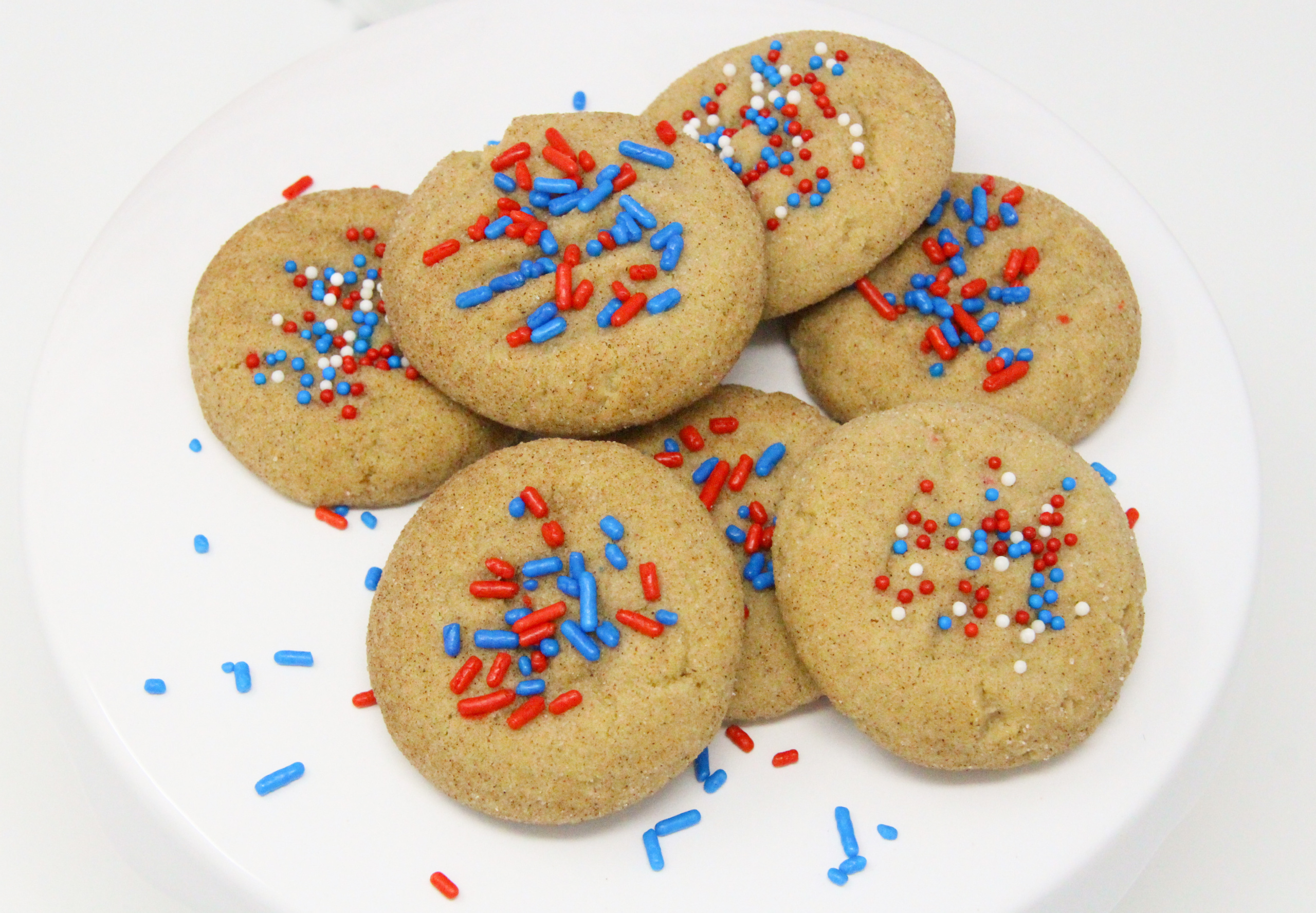 Basically snickerdoodles, the addition of colorful, patriotic sprinkles earns them the name of Yankerdoodles. With the addition of brown sugar to provide a deeper flavor, these soft, childhood favorite cookies will bring back wonderful memories and create new memories with your own family. Recipe shared with permission granted by Maddie Day, author of BATTER OFF DEAD. 