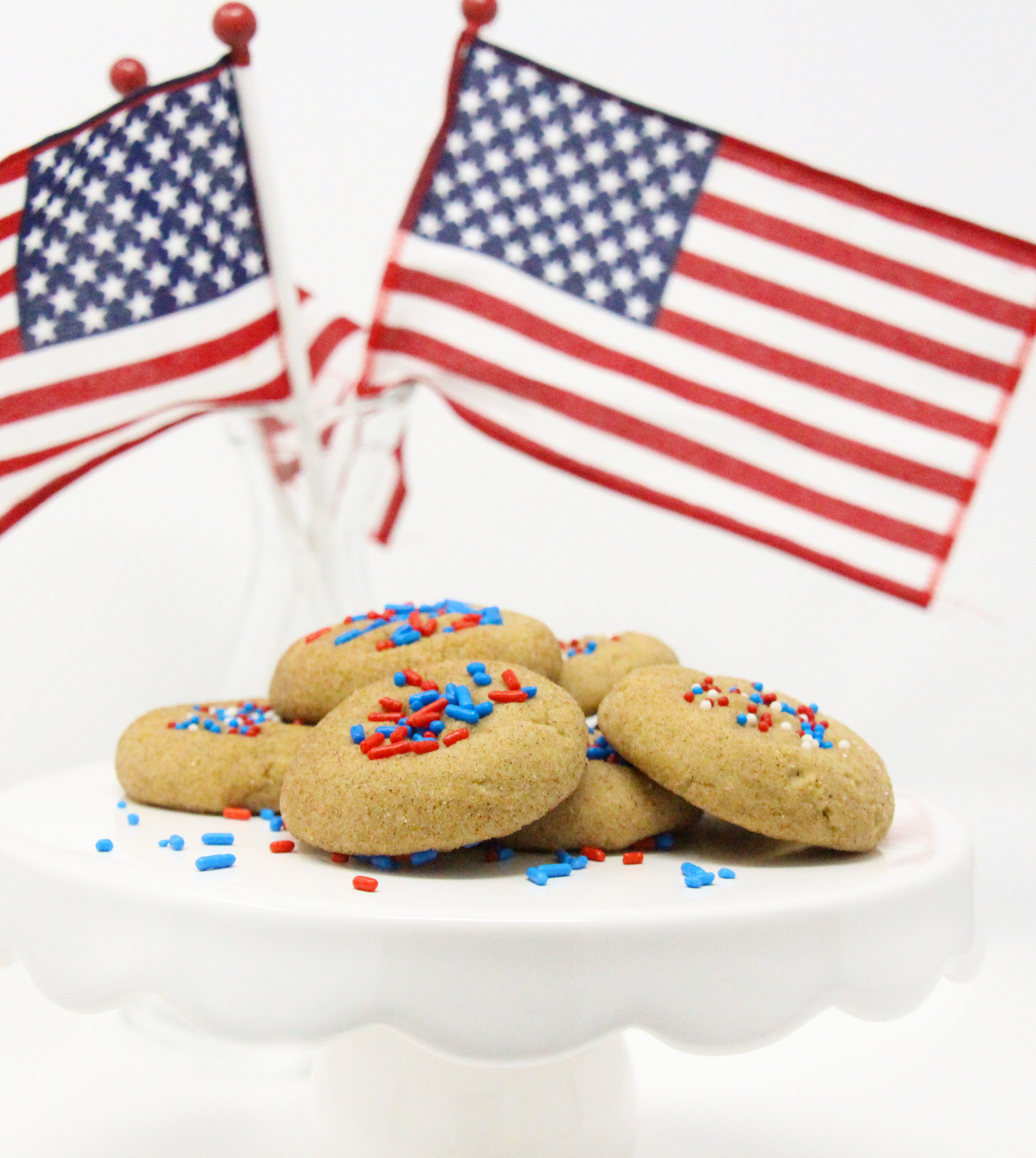 Basically snickerdoodles, the addition of colorful, patriotic sprinkles earns them the name of Yankerdoodles. With the addition of brown sugar to provide a deeper flavor, these soft, childhood favorite cookies will bring back wonderful memories and create new memories with your own family. Recipe shared with permission granted by Maddie Day, author of BATTER OFF DEAD. 