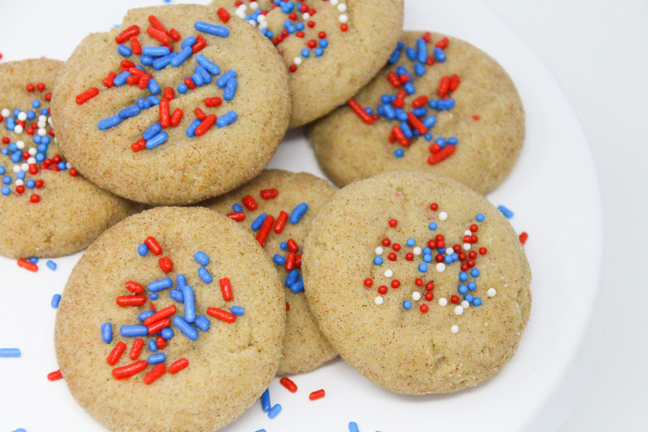 Basically snickerdoodles, the addition of colorful, patriotic sprinkles earns them the name of Yankerdoodles. With the addition of brown sugar to provide a deeper flavor, these soft, childhood favorite cookies will bring back wonderful memories and create new memories with your own family. Recipe shared with permission granted by Maddie Day, author of BATTER OFF DEAD. 