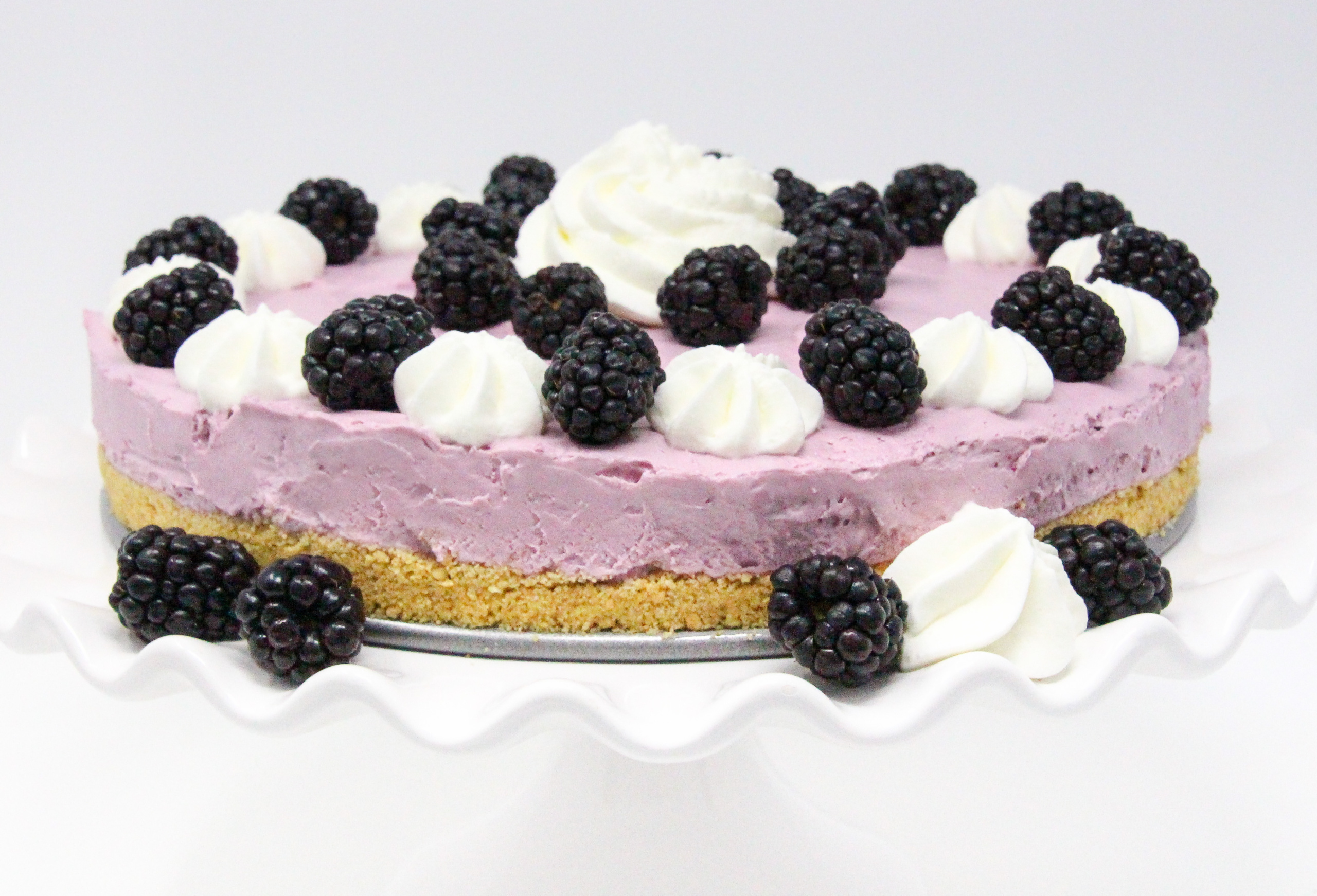 Perfect for hot summer weather, Blackberry No-Bake Cheesecake has a creamy, rich flavor without turning on the oven! Recipe shared with permission granted by Krista Davis, author of THE DIVA SAYS CHEESECAKE. 