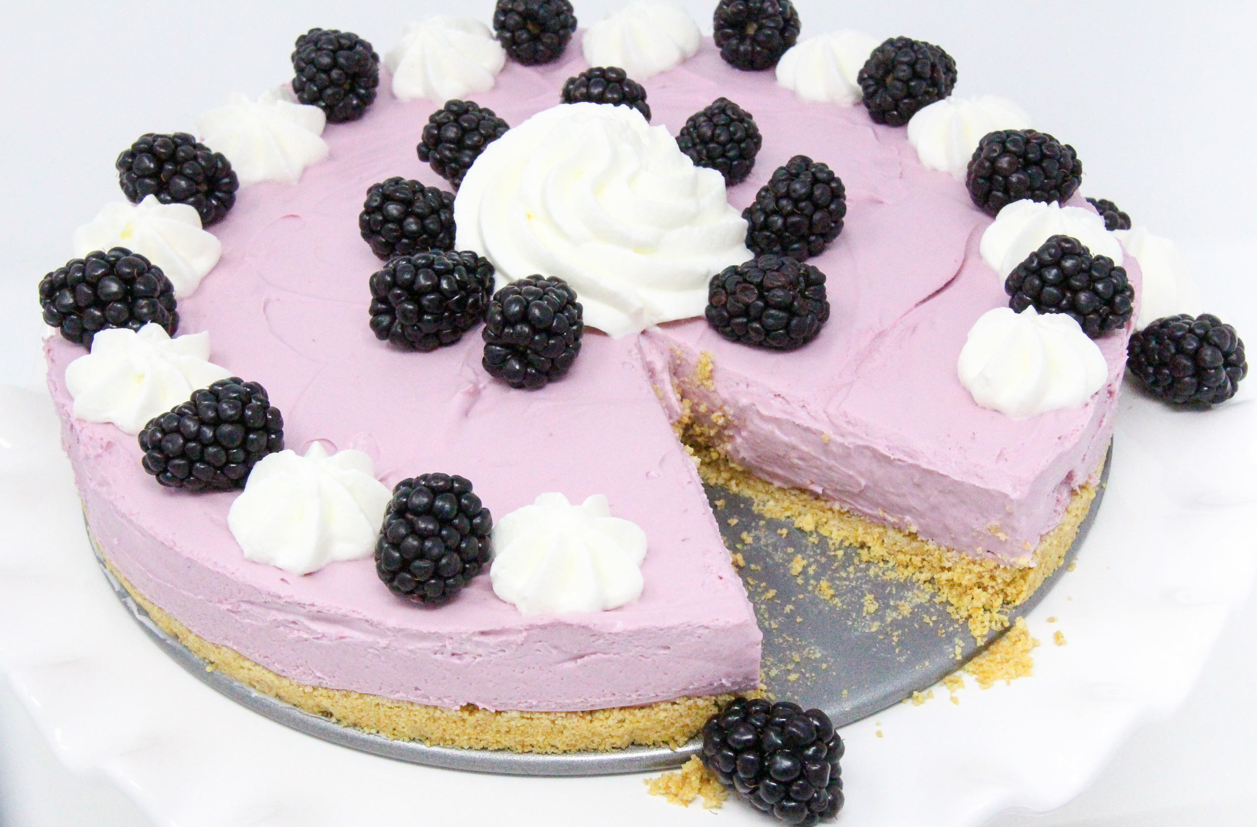 Perfect for hot summer weather, Blackberry No-Bake Cheesecake has a creamy, rich flavor without turning on the oven! Recipe shared with permission granted by Krista Davis, author of THE DIVA SAYS CHEESECAKE. 