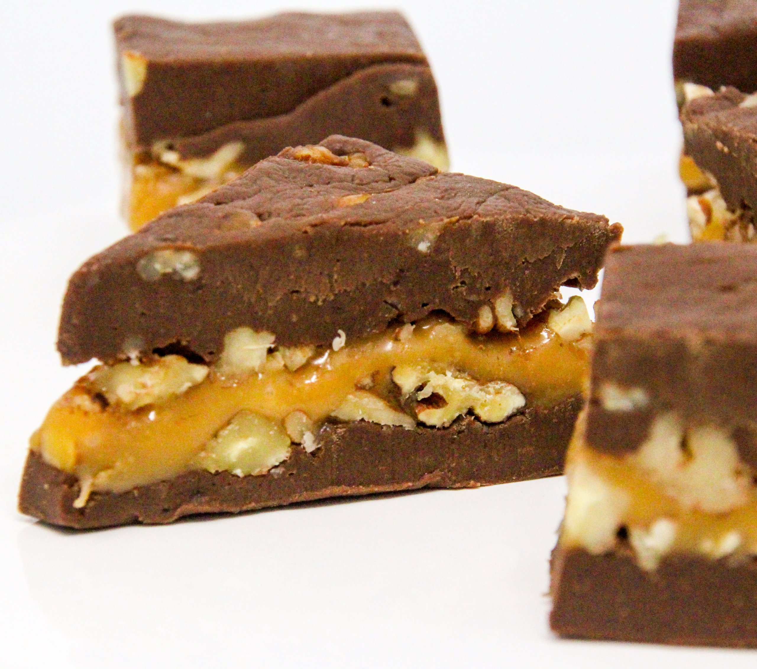 Turtle Fudge utilizes pantry-stable items like caramel pieces, chocolate chips, and sweetened condensed milk yet the resulting treat is candy shop worthy! Recipe shared with permission granted by Nancy Coco, author of A Midsummer Night's Fudge. 