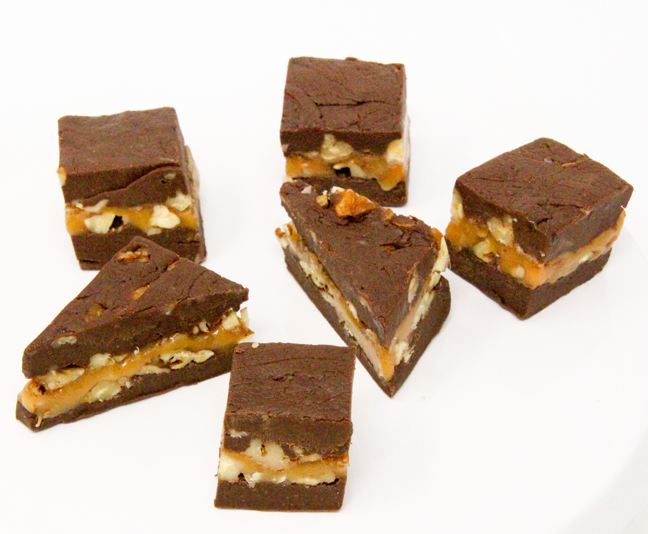 Turtle Fudge utilizes pantry-stable items like caramel pieces, chocolate chips, and sweetened condensed milk yet the resulting treat is candy shop worthy! Recipe shared with permission granted by Nancy Coco, author of A Midsummer Night's Fudge. 