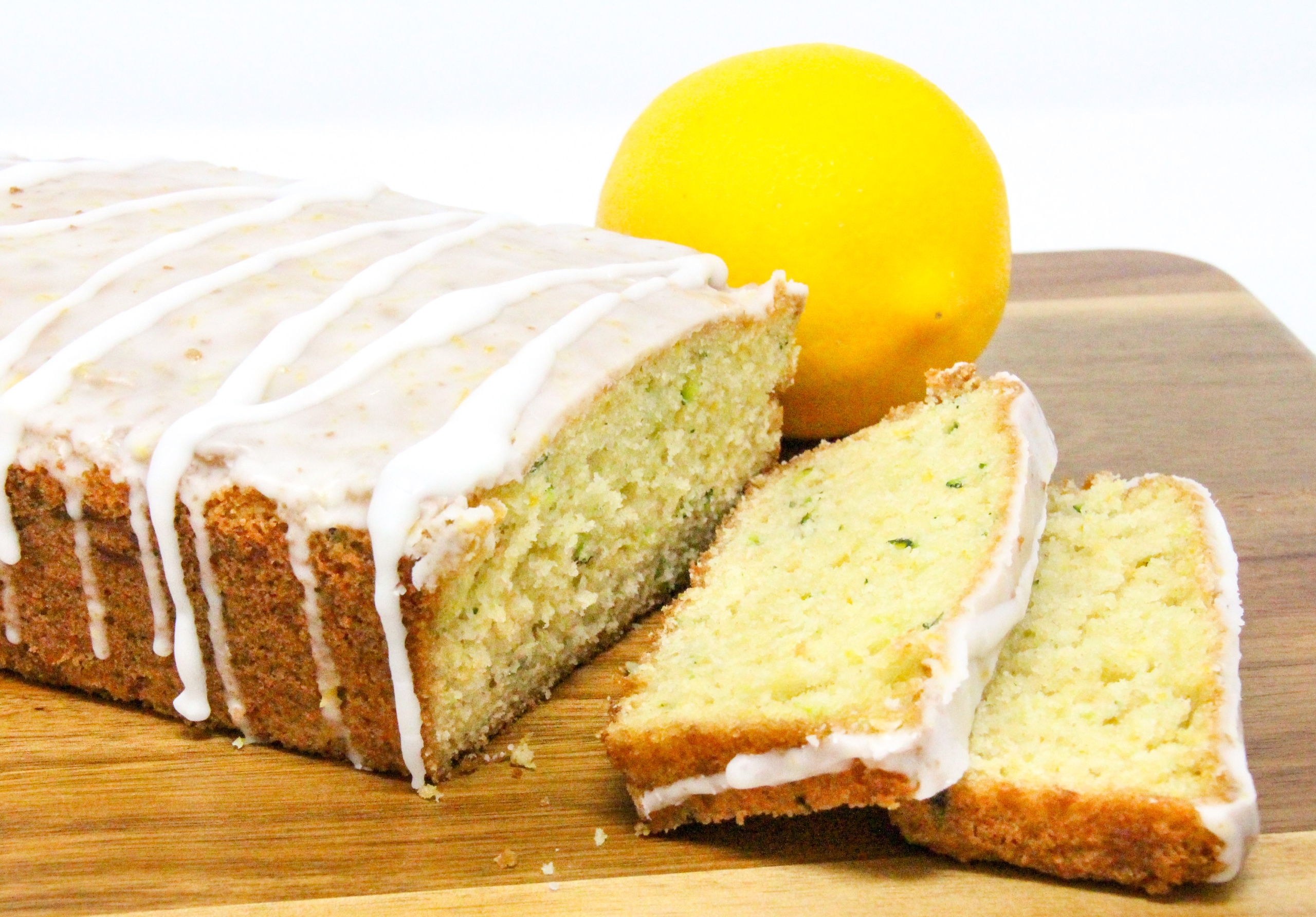 Lemon Zucchini Bread is simple to make. The lemon juice gives it a lighter flavor and the lemony glaze makes it taste indulgent. Recipe shared with permission granted by Valerie Burns, author of TWO PARTS SUGAR, ONE PART MURDER.