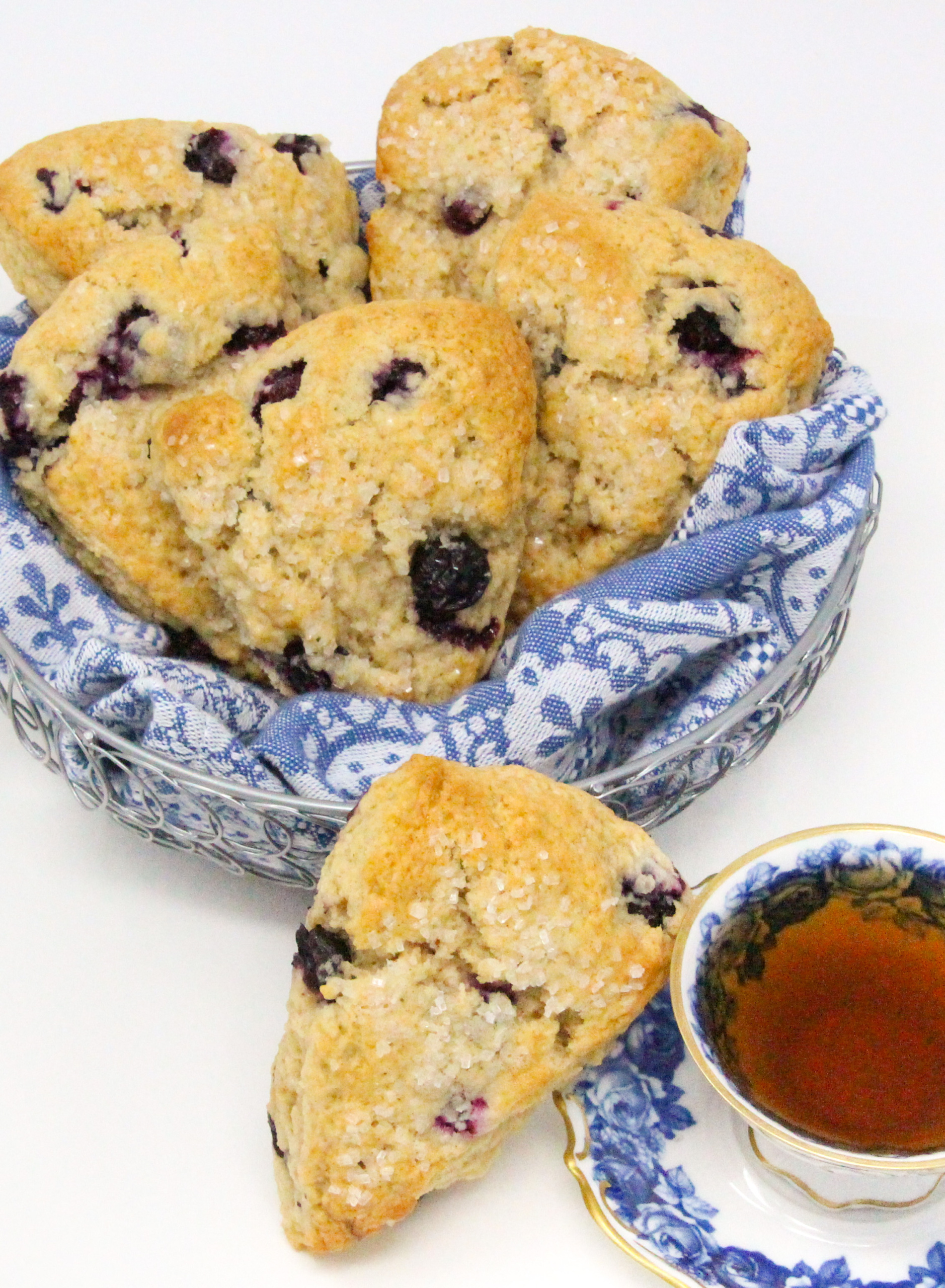 Flaky, rich, and with the yummy sweetness of the blueberries, these Blueberry Scones can be made year-round thanks to being able to use either fresh or frozen blueberries, depending on the season. Recipe shared with permission granted by Maddie Day, author of MURDER IN A CAPE COTTAGE. 