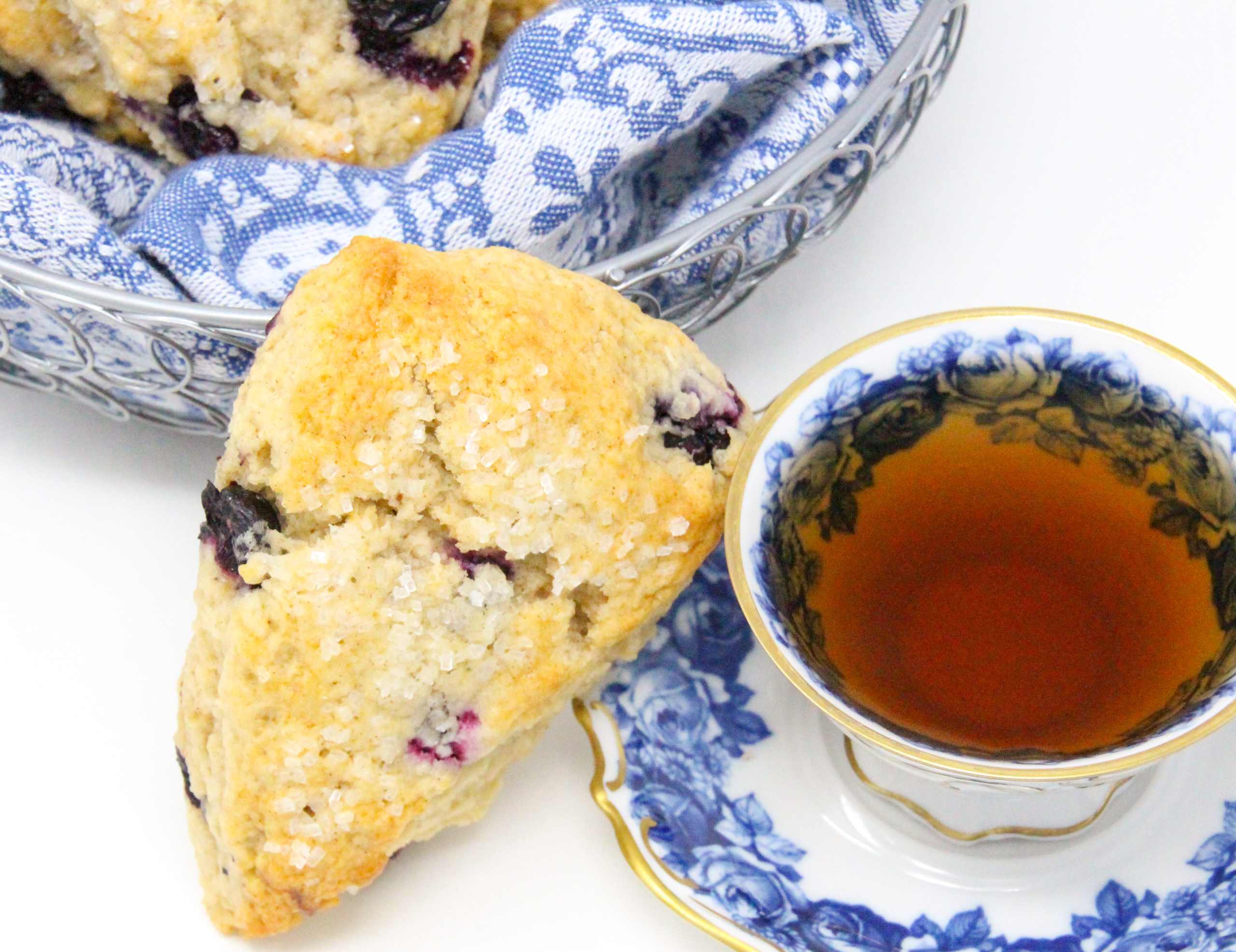 Flaky, rich, and with the yummy sweetness of the blueberries, these Blueberry Scones can be made year-round thanks to being able to use either fresh or frozen blueberries, depending on the season. Recipe shared with permission granted by Maddie Day, author of MURDER IN A CAPE COTTAGE. 