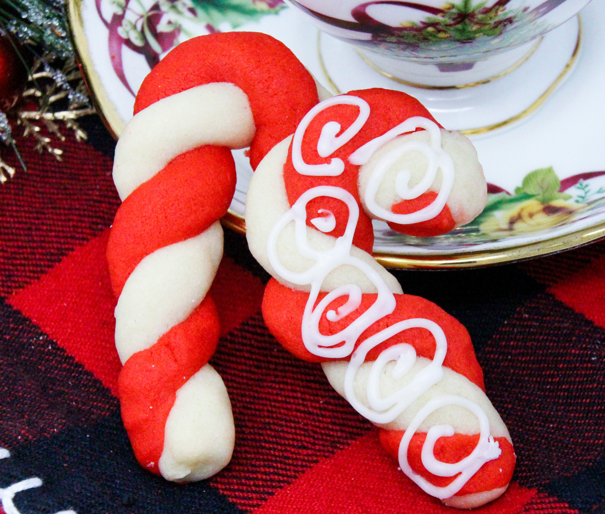 The colorful twists of the peppermint, and red Candy Cane cookies will add a delicious and jolly look to your holiday cookie platter! Recipe shared with permission granted by Leslie Budewitz, author of PEPPERMINT BARKED. 