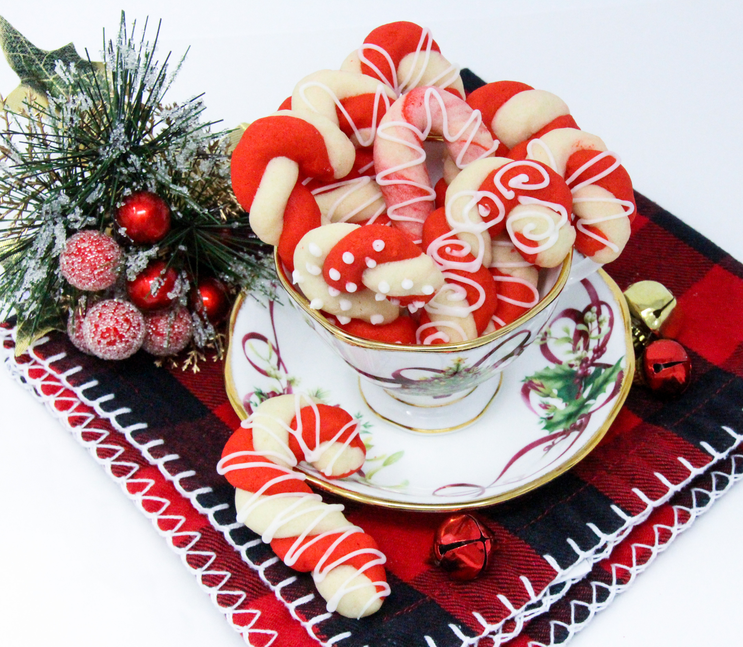 The colorful twists of the peppermint, and red Candy Cane cookies will add a delicious and jolly look to your holiday cookie platter! Recipe shared with permission granted by Leslie Budewitz, author of PEPPERMINT BARKED. 