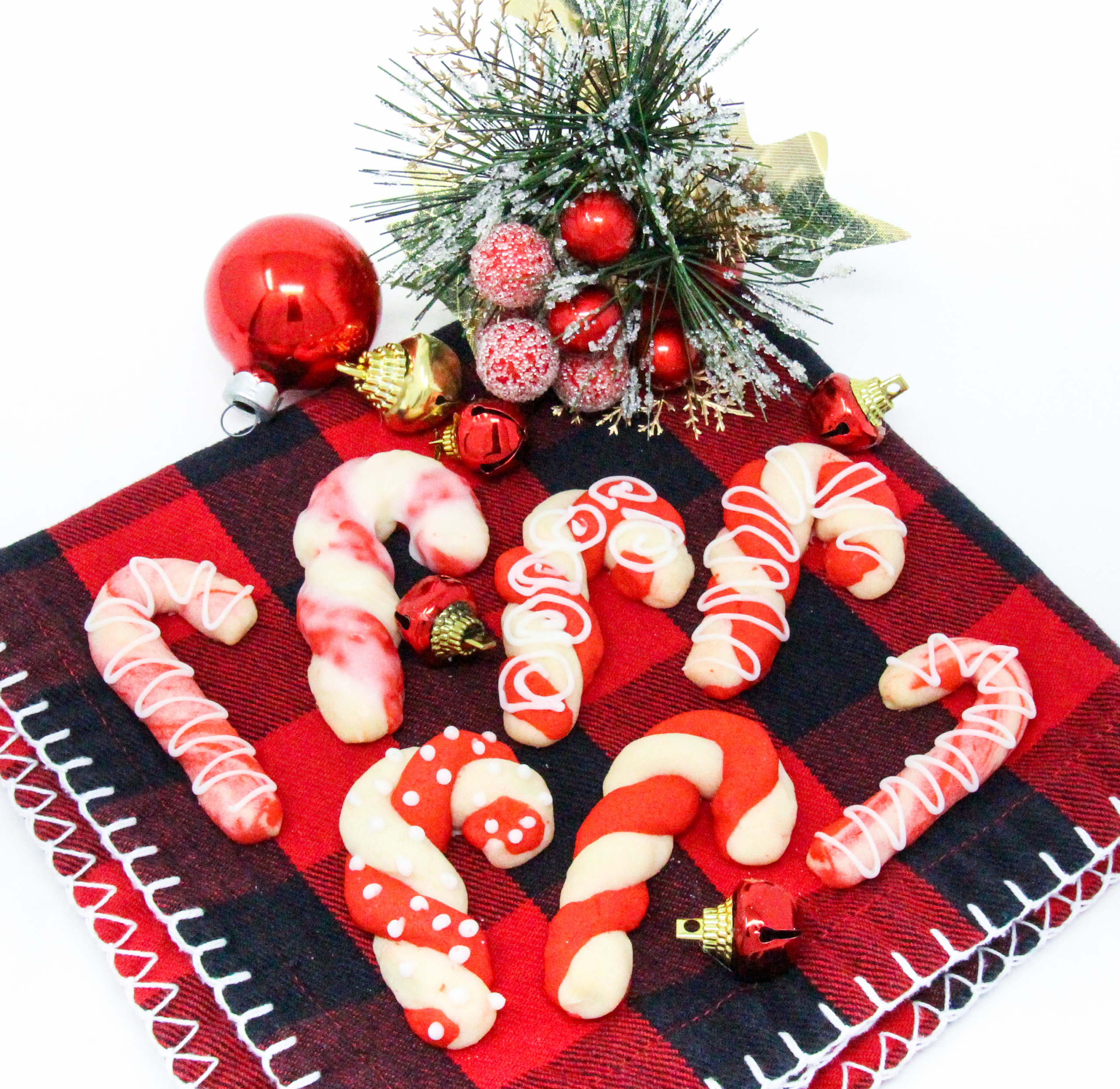 The colorful twists of the peppermint, and red Candy Cane cookies will add a delicious and jolly look to your holiday cookie platter! Recipe shared with permission granted by Leslie Budewitz, author of PEPPERMINT BARKED. 