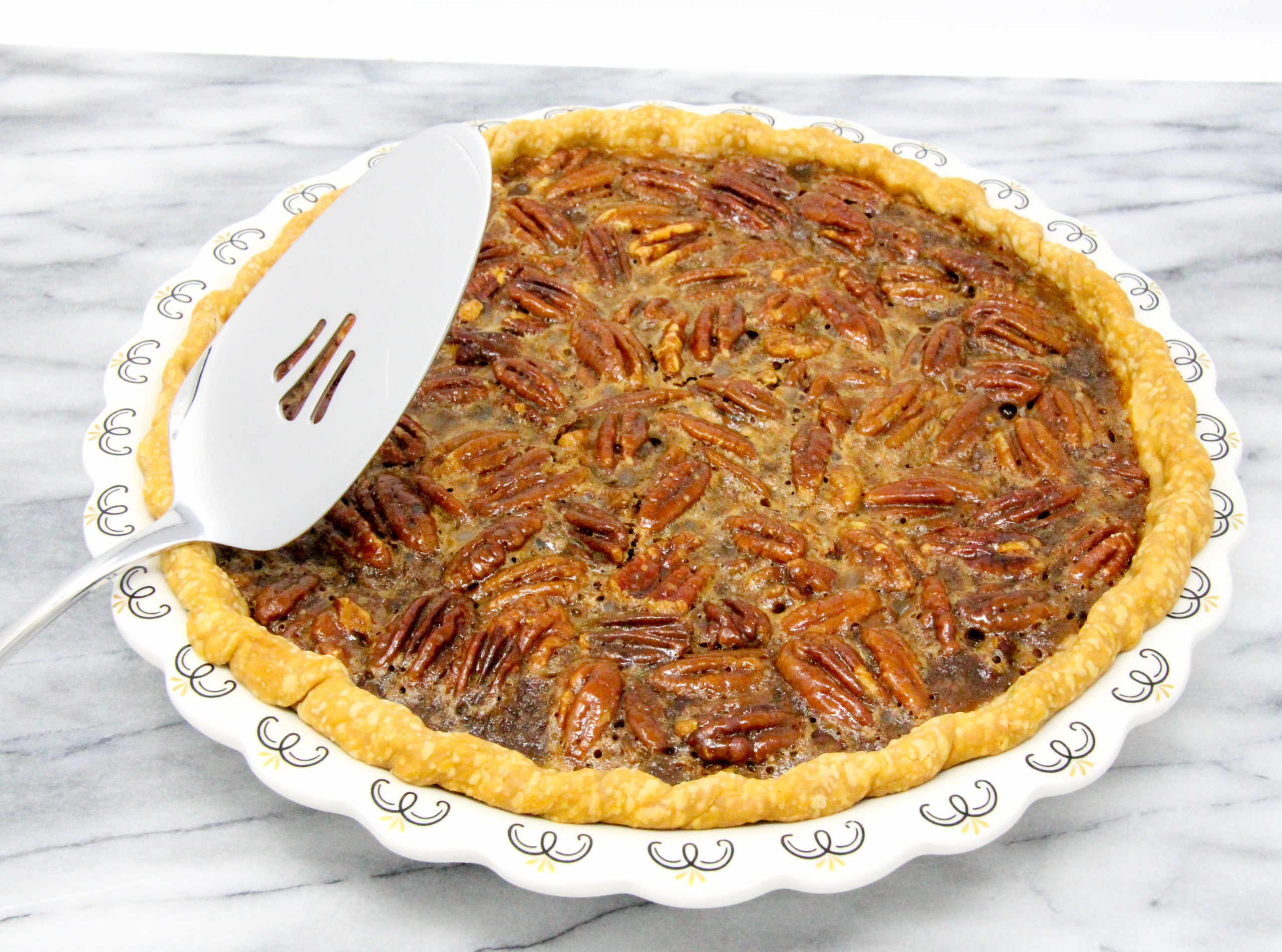 Cardamom Pecan Pie has plenty of natural sweetness thanks to maple syrup and a generous amount of pecans. The hint of cardamom elevates the flavor to scrumptious! Recipe shared with permission granted by Barbara Ross, author of MUDDLED THROUGH.