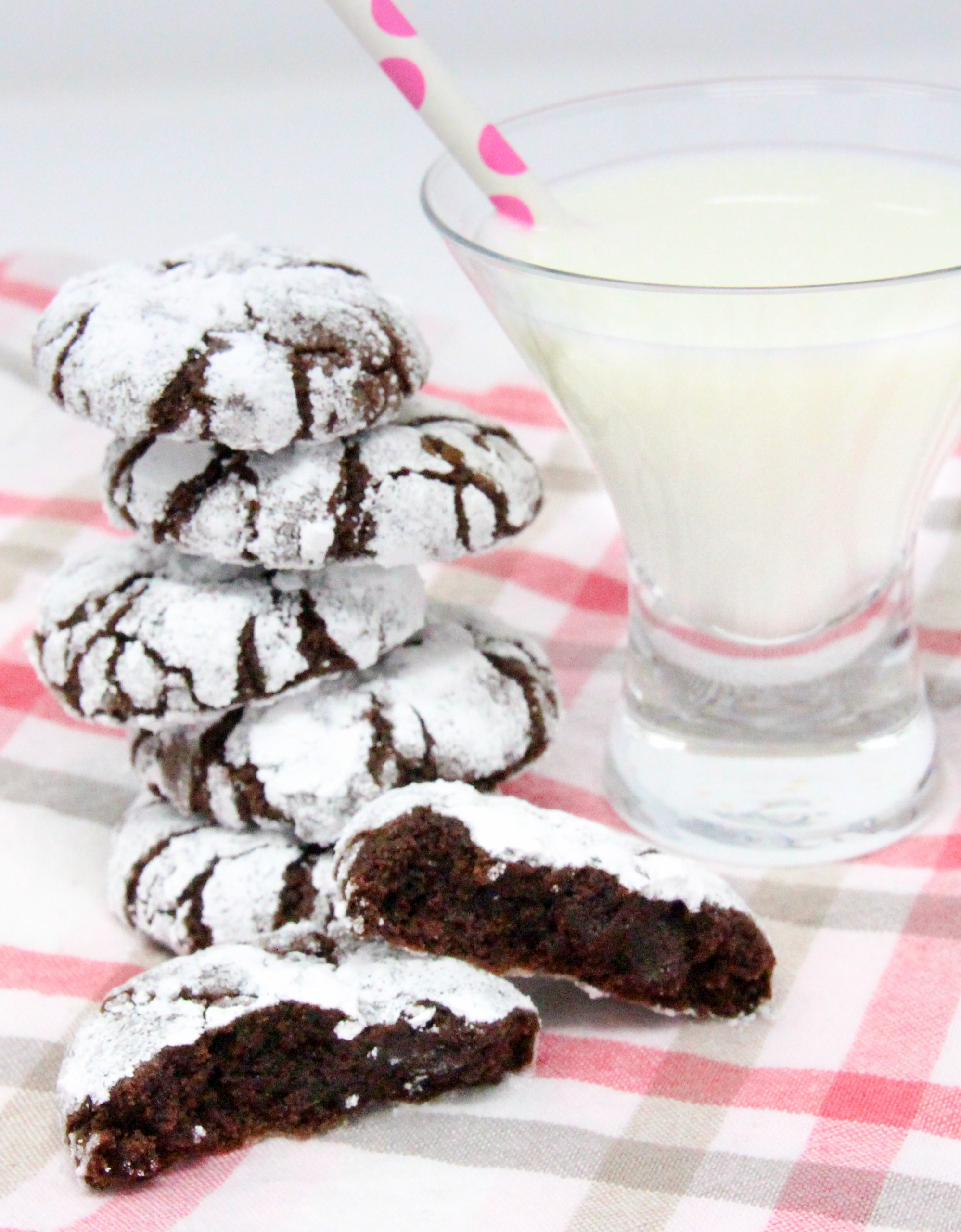 Chocolate Crinkles are rolled into both granulated and powdered sugar before baking, giving the cookies a crisp edge and a fudgy interior cookie - heavenly! Recipe shared with permission granted by Daryl Wood Gerber, author of A HINT OF MISCHIEF.