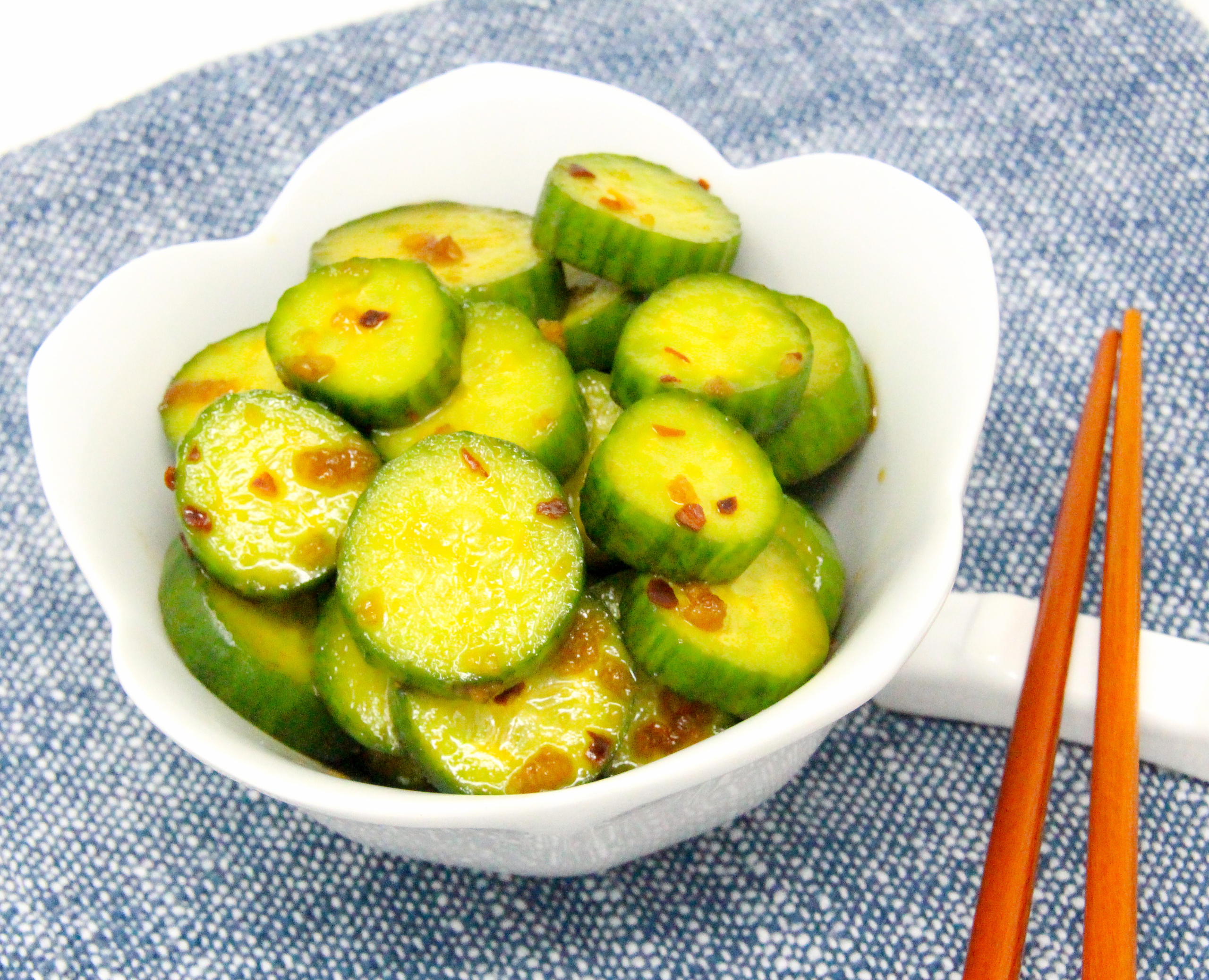 Tangy and a touch of heat, Spicy Cucumber Salad makes a great accompaniment to any roasted or sautéed meat entrée or whenever you want a refreshing way to showcase your bountiful garden harvest of cucumbers. Recipe shared with permission granted by Jennifer J. Chow, author of DEATH BY BUBBLE TEA. 