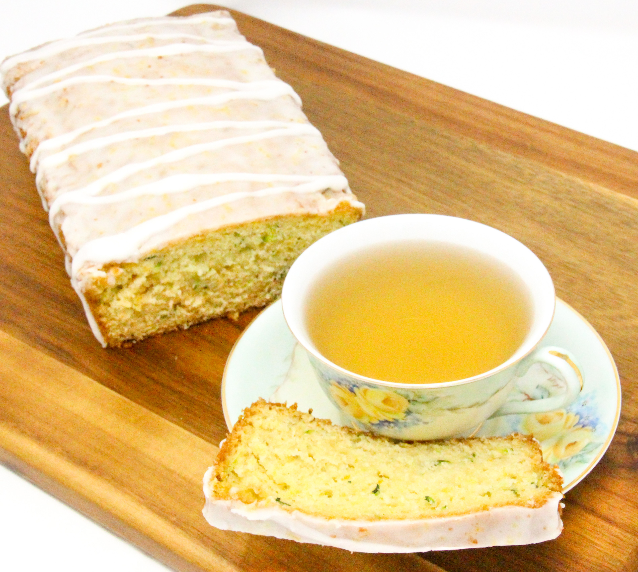 Lemon Zucchini Bread is simple to make. The lemon juice gives it a lighter flavor and the lemony glaze makes it taste indulgent. Recipe shared with permission granted by Valerie Burns, author of TWO PARTS SUGAR, ONE PART MURDER.