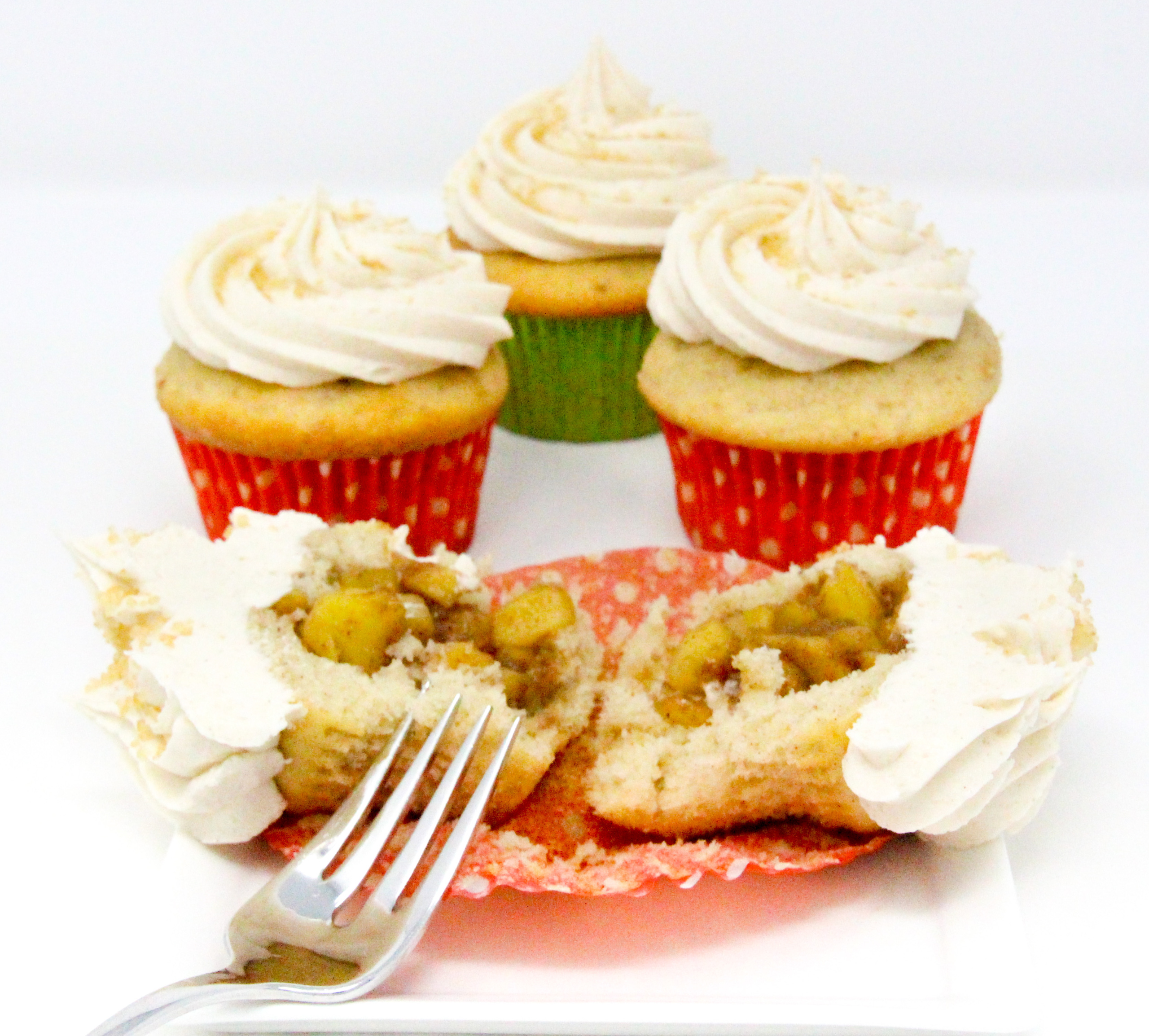 With a makeover, these boxed cake mix-based Apple-Pie Filled Cupcakes bring autumn flavors to the dessert table! Recipe shared with permission granted by Kim Davis, author of BUTTERCREAM BETRAYAL. 