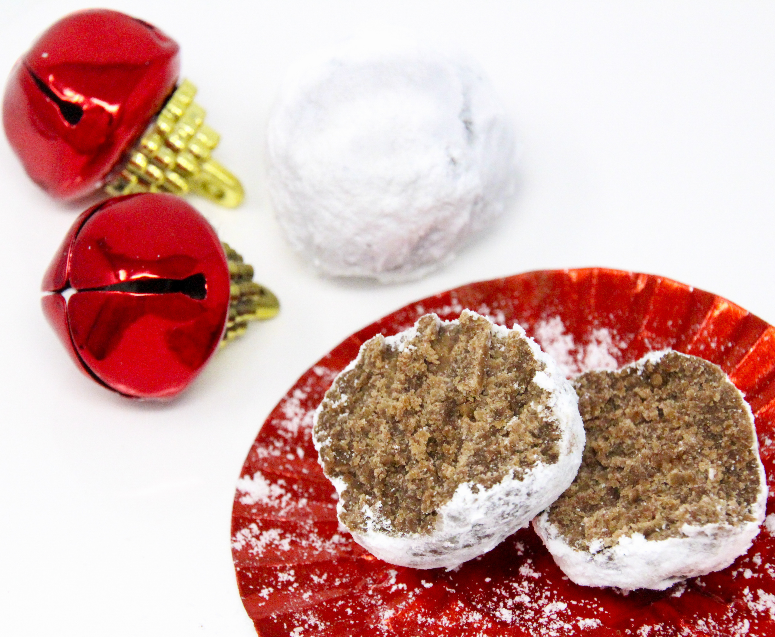 No-Bake Rum Ball Cookies only require a few simple ingredients and a quick whirl in the food process for delicious, easy to make treats. Recipe created by Cinnamon & Sugar for Catherine Bruns, author of SEASONED WITH MURDER. 