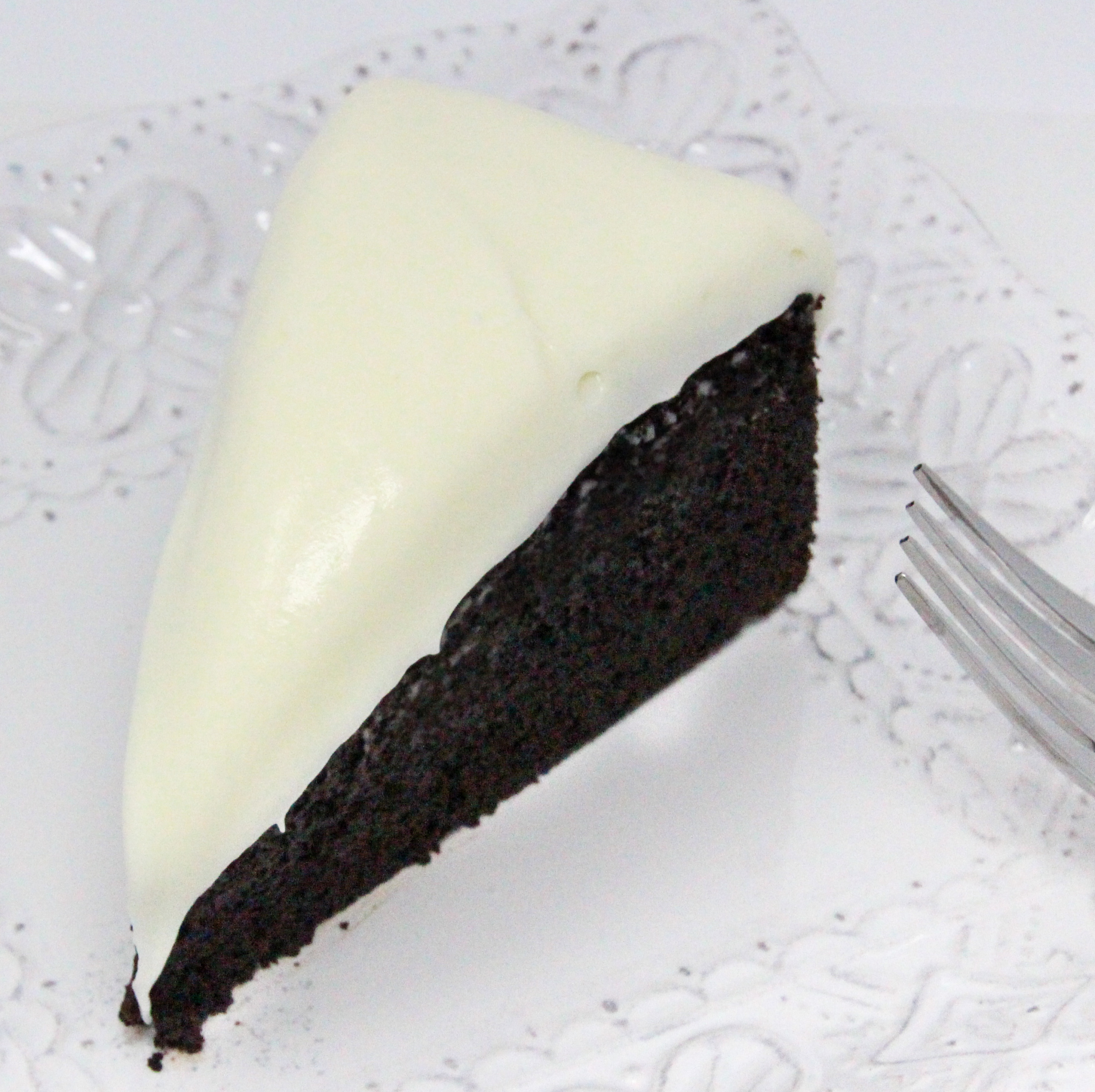 Ultra chocolaty, Chocolate Guinness Cake is moist and rich, thanks to a generous measure of cocoa, Guinness, and sour cream. Topped with tangy cream cheese frosting elevates the dessert to pure deliciousness. Recipe shared with permission granted by Carlene O'Connor, author of MURDER AT AN IRISH BAKERY. 