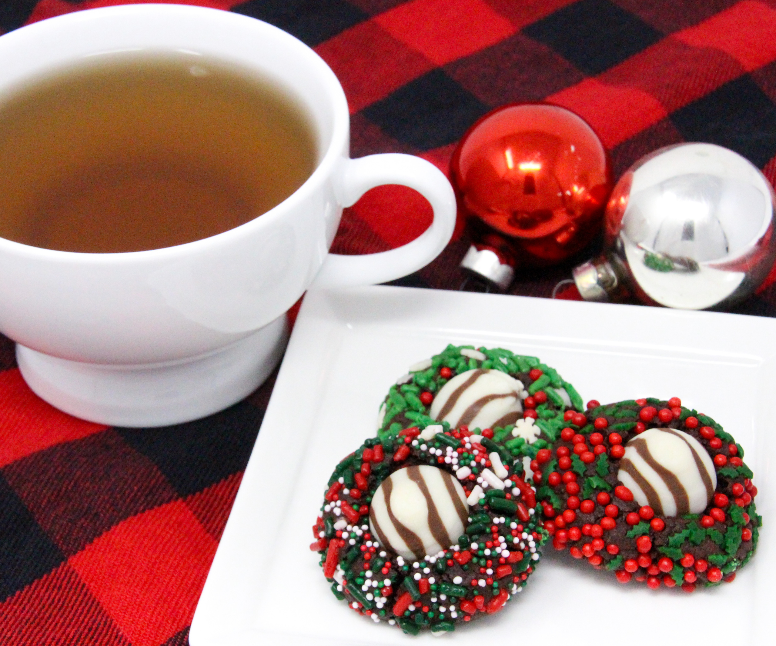 Christmas Hugs & Kisses Cookies have a chocolate base with a hint of peppermint. Rolled in colorful holiday sprinkles before baking then topped with a Hershey’s Hug or Kiss for an extra bite of chocolate will have Santa linger hearthside to finish a plate of these festive cookies! Recipe created by Cinnamon & Sugar for Deborah Garner, author of JOY AT MOONGLOW. 