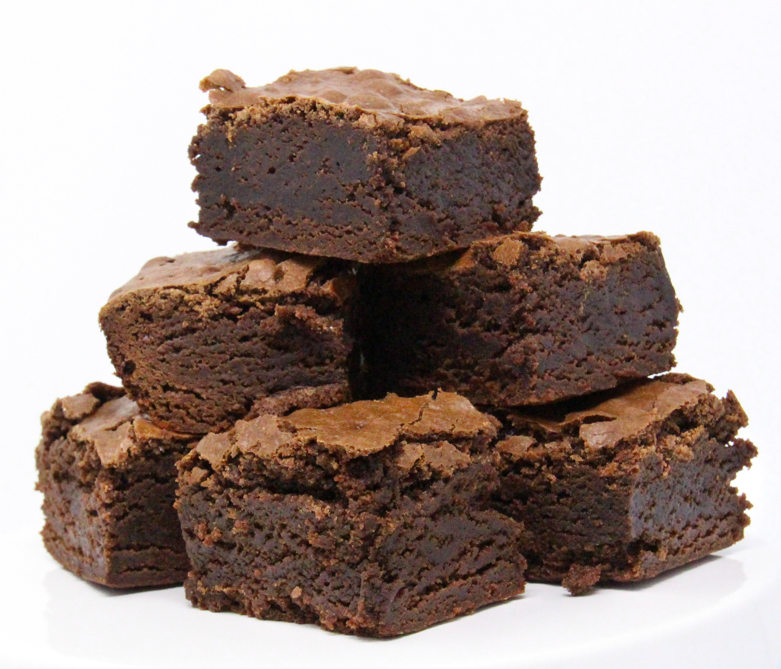 Ground Rules Espresso Brownies are oh-so-rich… and chocolaty. The added espresso raises the deliciousness factor and magnifies the yummy taste of chocolate. Recipe shared with permission granted by Emmeline Duncan, author of FLAT WHITE FATALITY. 