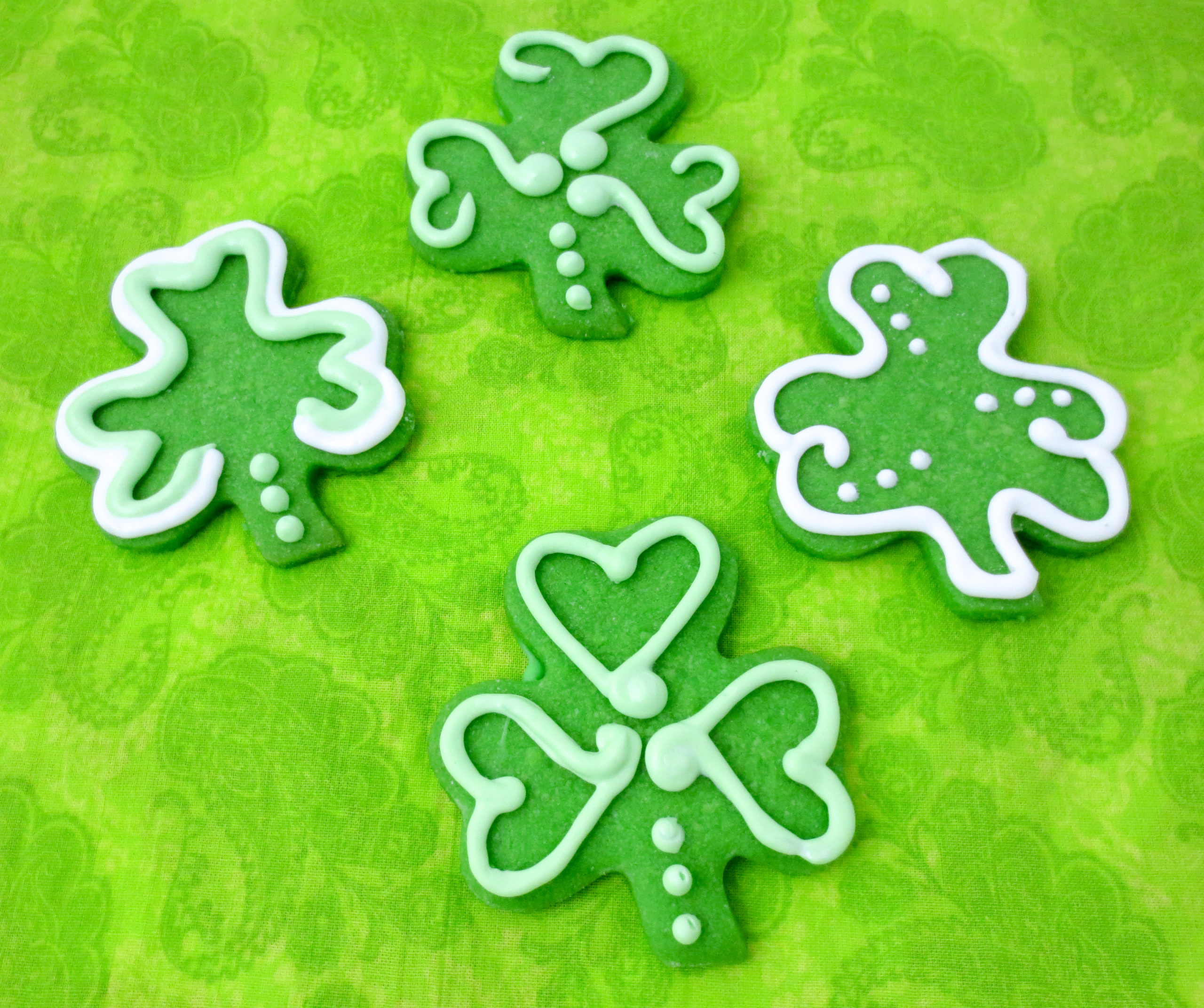 Shamrock cookies are mint-flavored sugar cookies decorated with royal icing (and/or sprinkles) in the quintessential St. Patrick’s Day shape. They are sure to bring a smile and good luck to everyone you share them with! Recipe developed by Cinnamon & Sugar for Deborah Garner, author of A FLAIR FOR SHAMROCKS. 