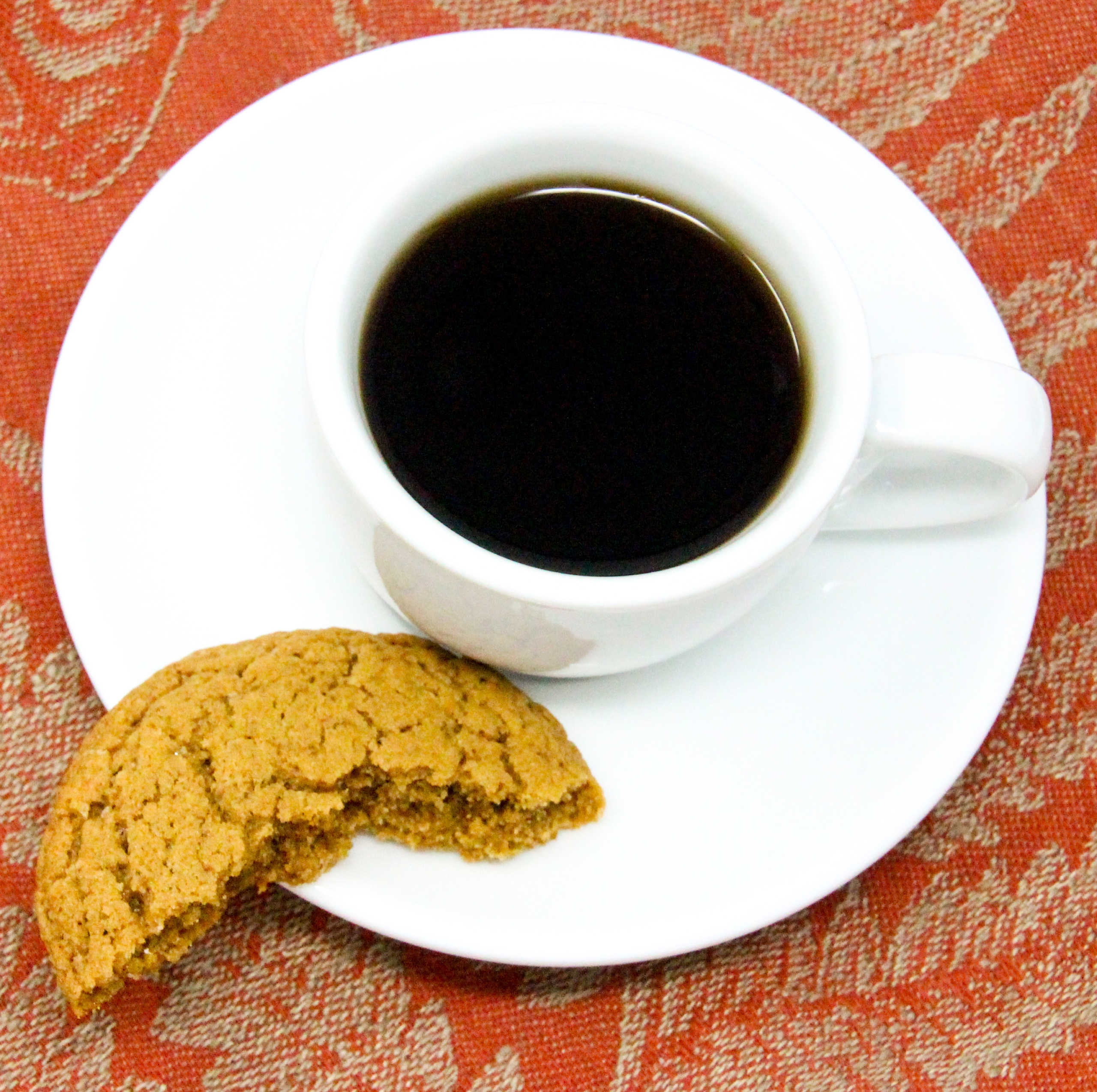 Coffee Crunch Cookies are a bit chewy on the inside and crunchy on the outside. The bitter, nutty taste of coffee is tempered by the caramel sweetness of brown sugar and a hint of cinnamon to round out the flavor. Recipe shared with permission granted by Daryl Wood Gerber, author of POACHING IS PUZZLING. 