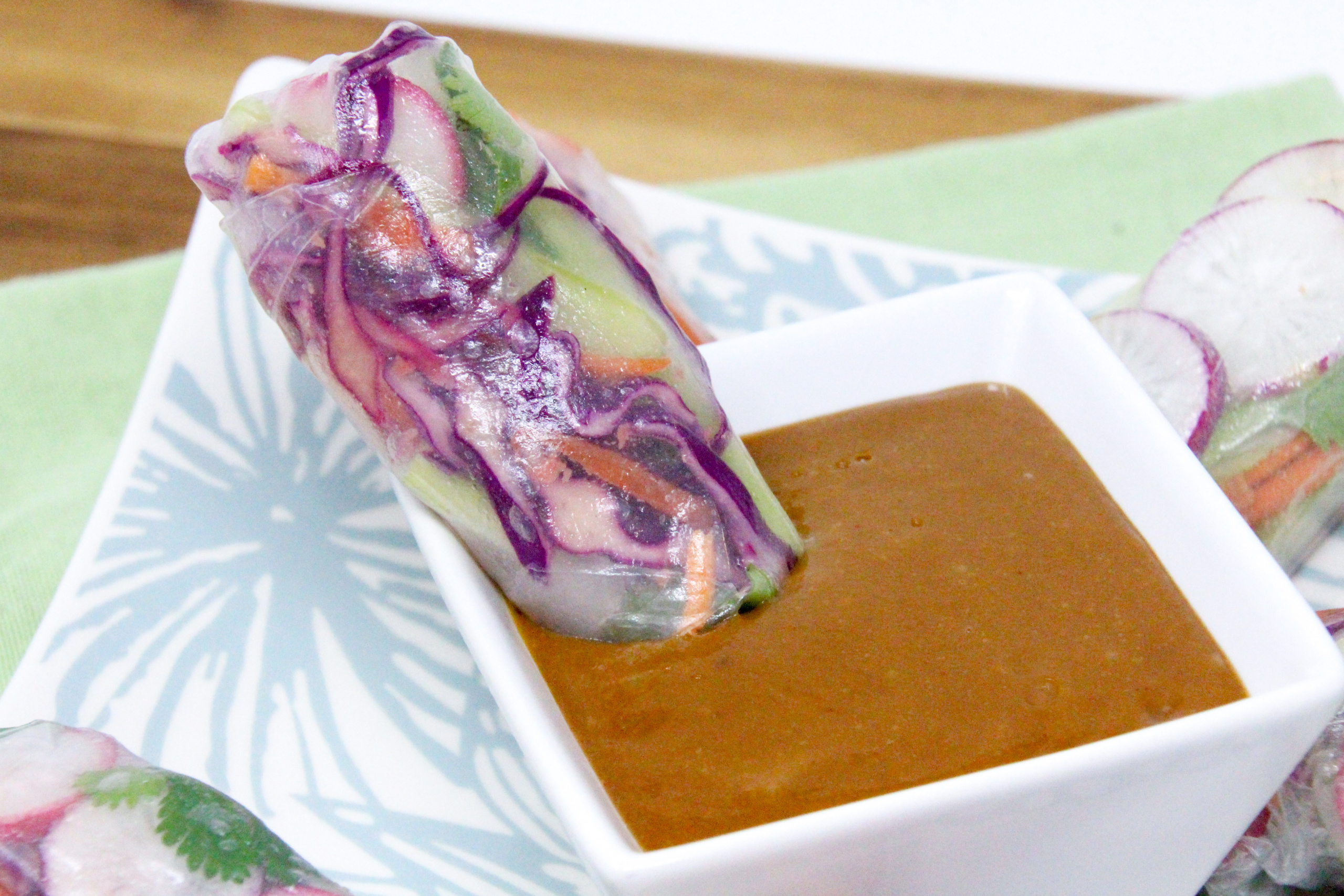 Vegetarian Spring Rolls with a Thai-inspired peanut butter dipping sauce is a delicious no-cook appetizer or side dish! Recipe shared with permission granted by Maddie Day, author of MURDER AT A CAPE BOOK STORE. 