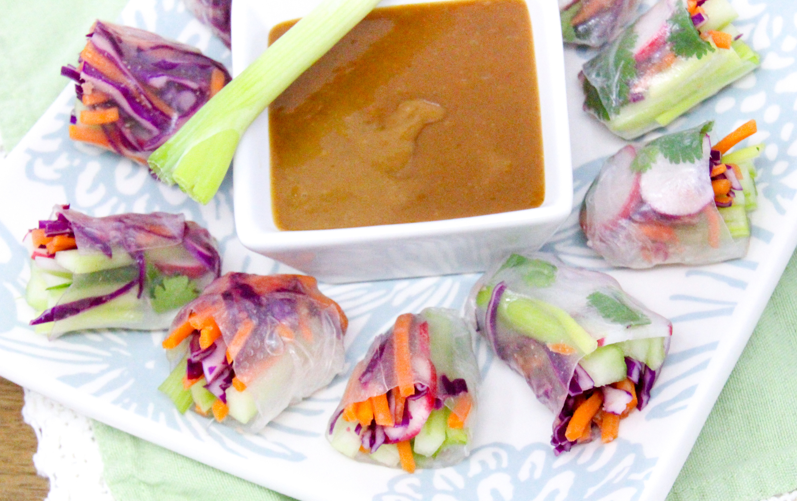 Vegetarian Spring Rolls with a Thai-inspired peanut butter dipping sauce is a delicious no-cook appetizer or side dish! Recipe shared with permission granted by Maddie Day, author of MURDER AT A CAPE BOOK STORE. 