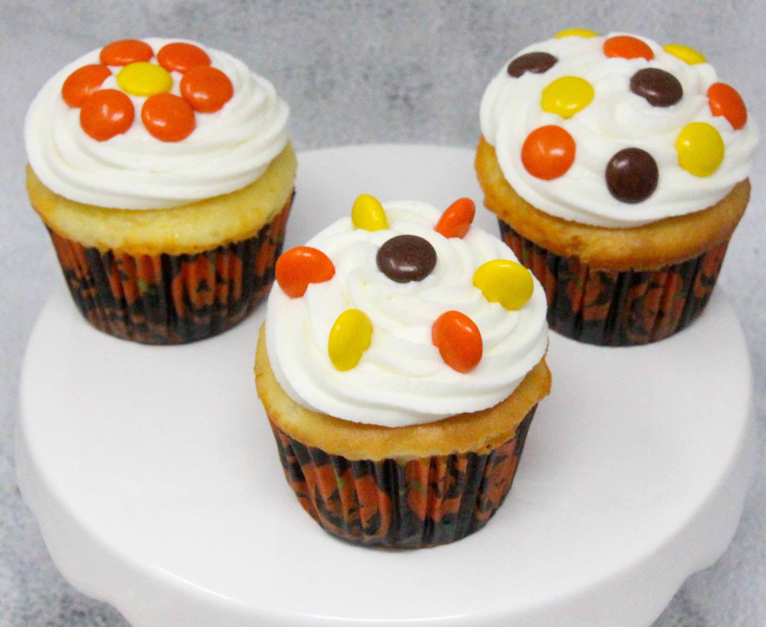 Triple-Layer Halloween Cupcakes is quick and easy, with a delicious combination of chocolate and orange flavors. With simple Reese’s Pieces used to decorate in orange and brown Halloween colors, these cupcakes will be sure to please your ghosts and ghouls! Recipe shared with permission granted by Carol J. Perry, author of A TRIPLE-LAYER HALLOWEEN MURDER.