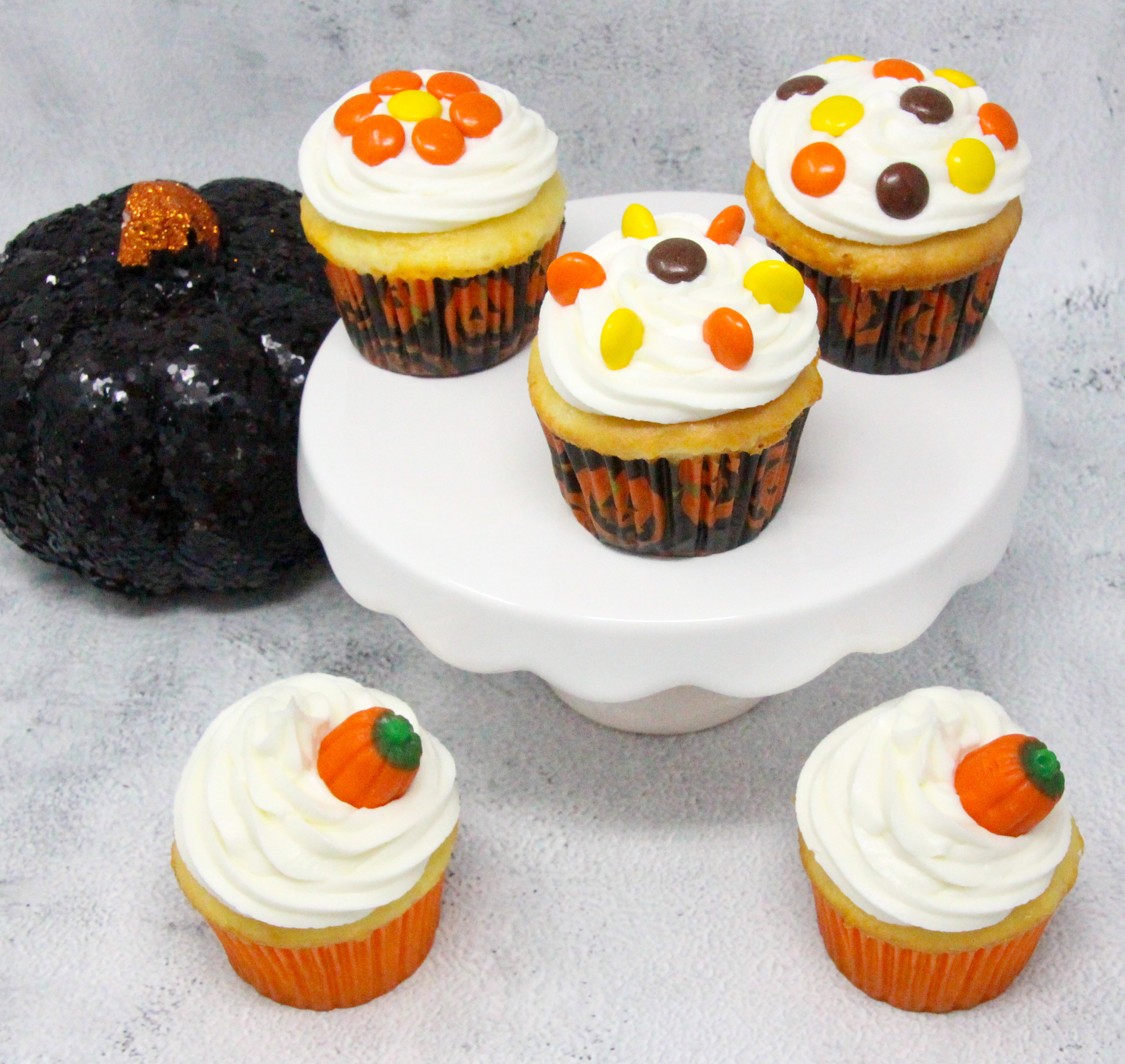 Triple-Layer Halloween Cupcakes is quick and easy, with a delicious combination of chocolate and orange flavors. With simple Reese’s Pieces used to decorate in orange and brown Halloween colors, these cupcakes will be sure to please your ghosts and ghouls! Recipe shared with permission granted by Carol J. Perry, author of A TRIPLE-LAYER HALLOWEEN MURDER.