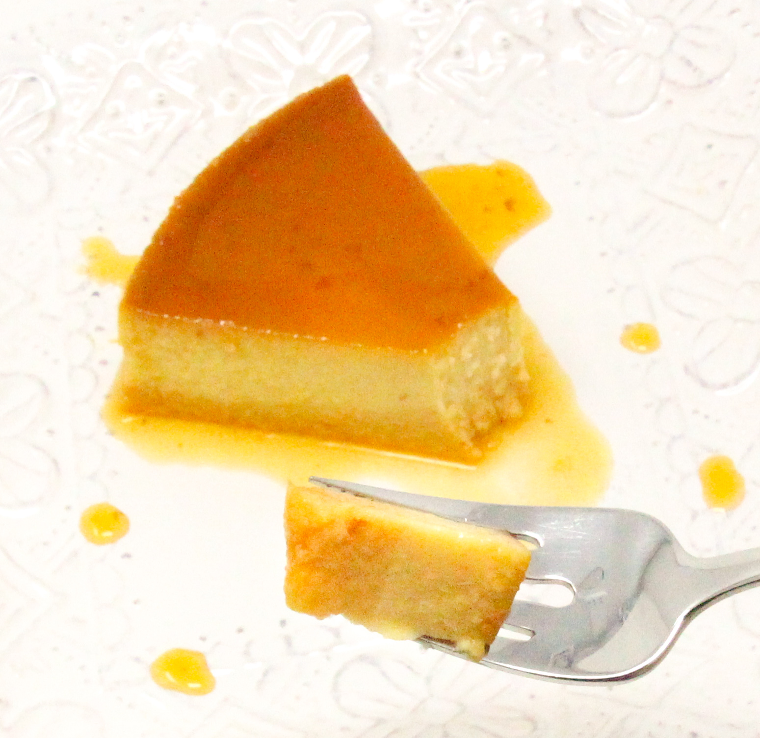 Raquel's Cala-FLAN-za includes a bit of pumpkin and cinnamon stick steeped milk for flavor making this flan every bit as creamy and delectable as what you'd order in a restaurant. Recipe shared with permission granted by Raquel V. Reyes, author of Mango, Mambo, and Murder. 