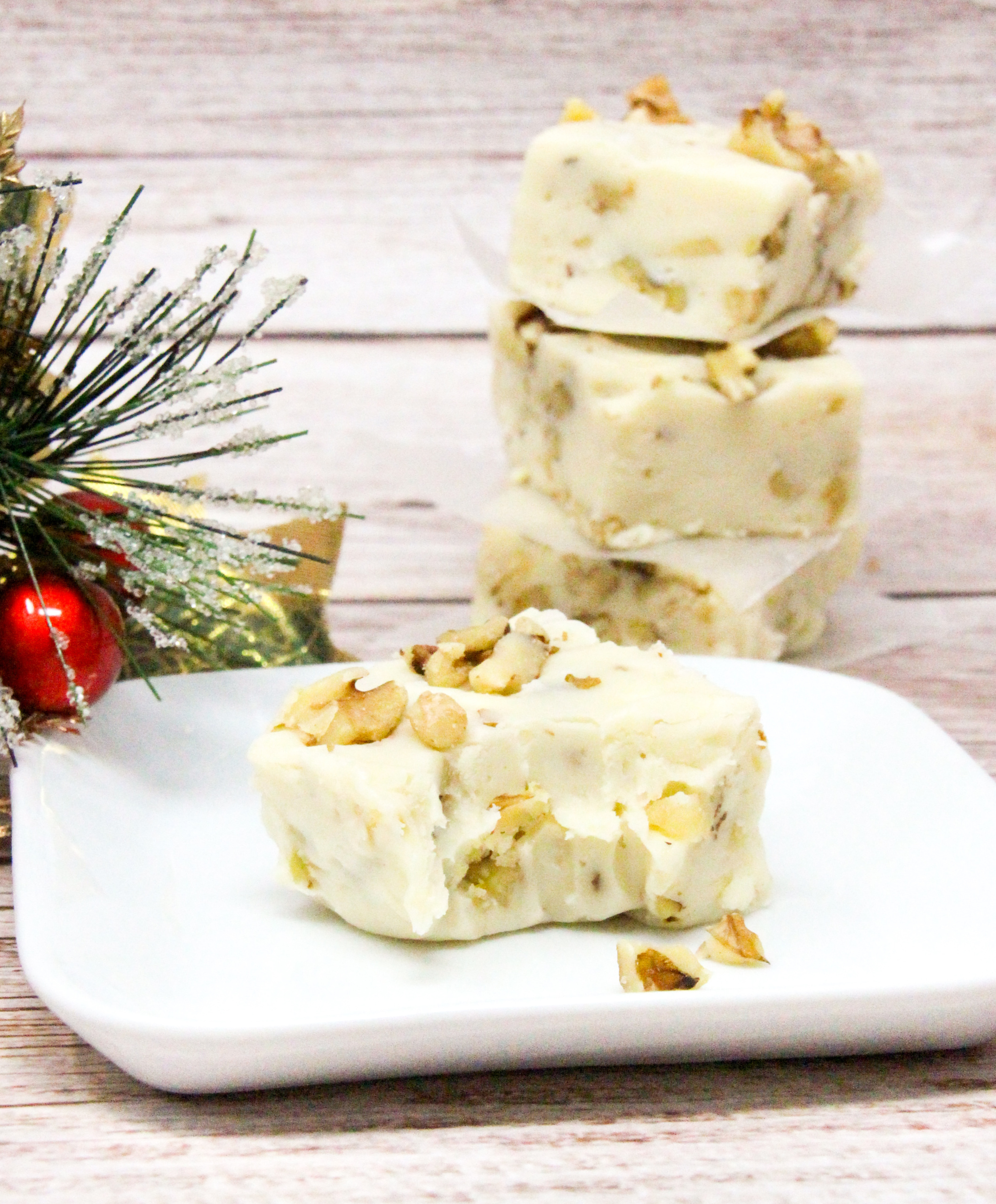 Using only six staple ingredients, and using the microwave to melt the white chocolate, Easy Maple Fudge comes together in a snap, making it a great addition to Christmas goodie platters or as a yummy gift to family and friends. Recipe shared with permission granted by Nancy Coco, author of HAVING A FUDGY CHRISTMAS TIME. 