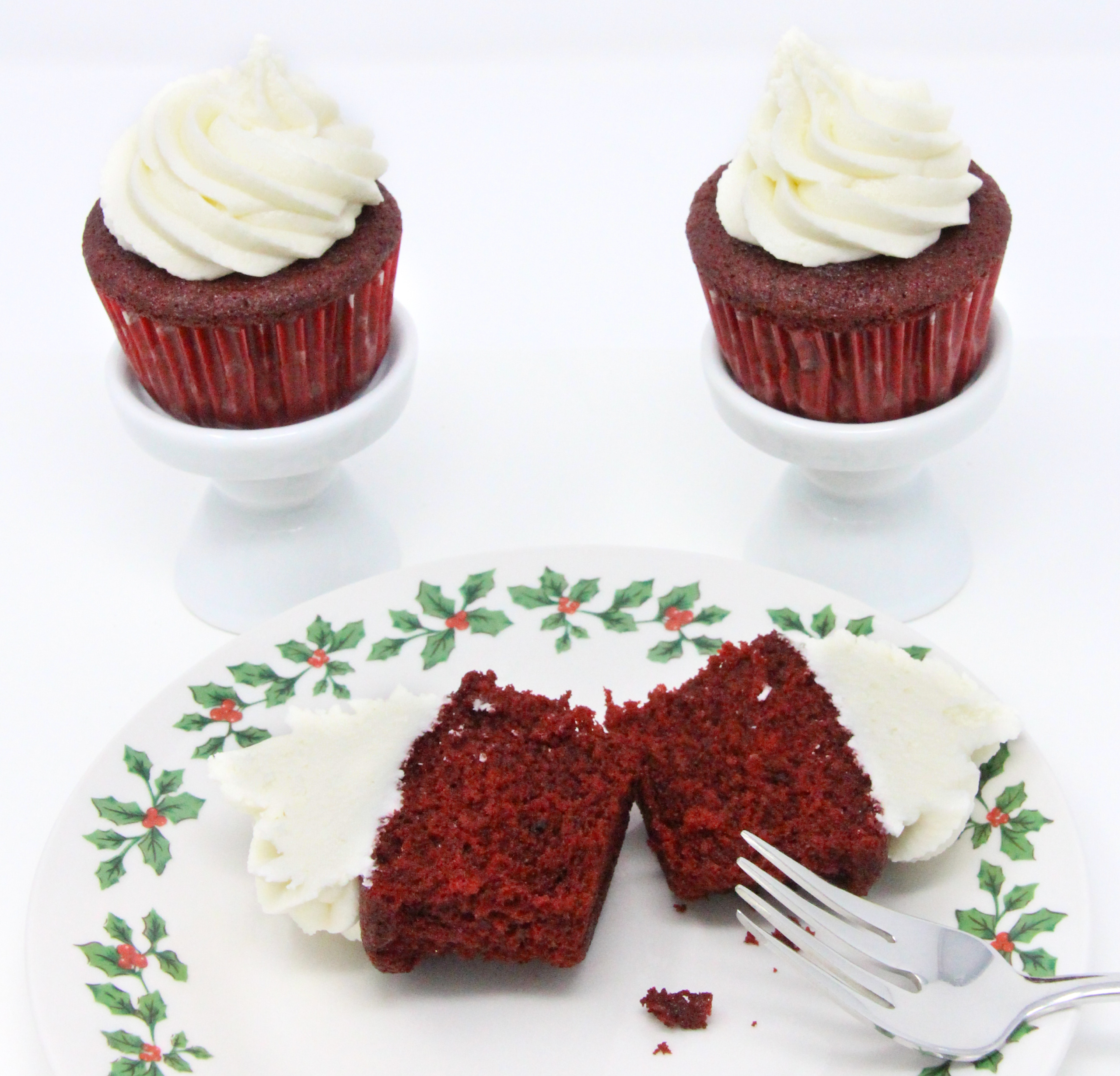 These red velvet cupcakes contain the perfect amount of chocolate and when topped with mounds of sweet buttercream frosting, the results are pure yumminess, making them a delicious way to celebrate the holidays! Recipe shared with permission granted by Christina Romeril, author of A NUTCRACKER NIGHTMARE. 