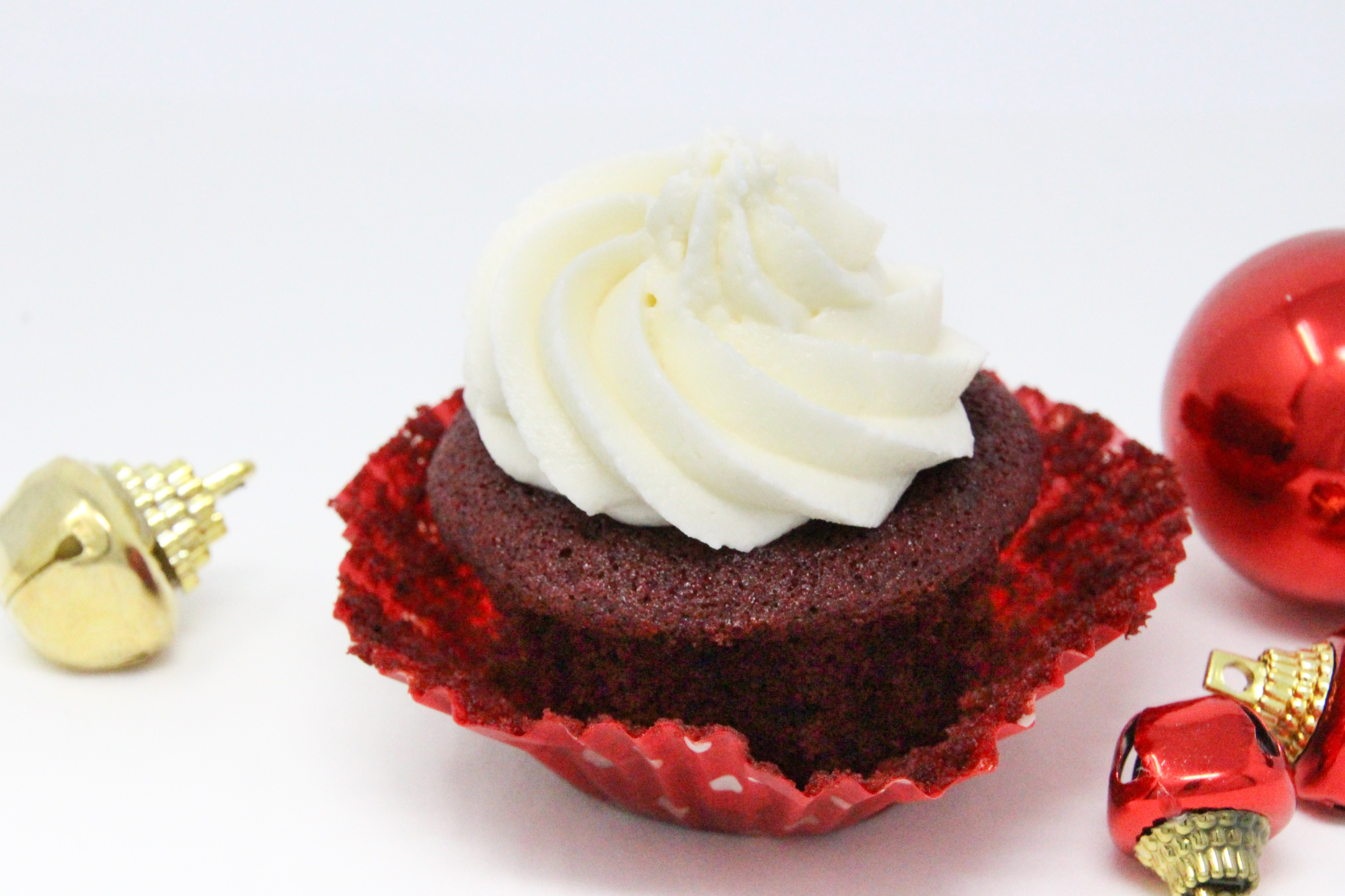 These red velvet cupcakes contain the perfect amount of chocolate and when topped with mounds of sweet buttercream frosting, the results are pure yumminess, making them a delicious way to celebrate the holidays! Recipe shared with permission granted by Christina Romeril, author of A NUTCRACKER NIGHTMARE. 