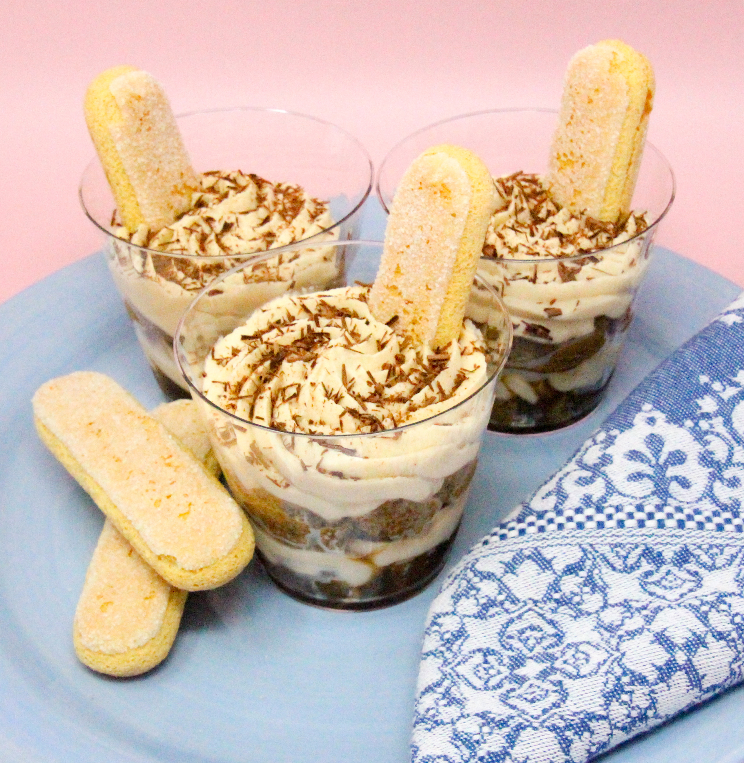 With yummy layers of coffee-dipped ladyfingers, Kahlúa-flavored mascarpone cheese, and whipped cream, your guests will be wowed by these mini Tiramisu Parfaits! Recipe shared with permission granted by Maya Corrigan, author of A PARFAIT CRIME. 