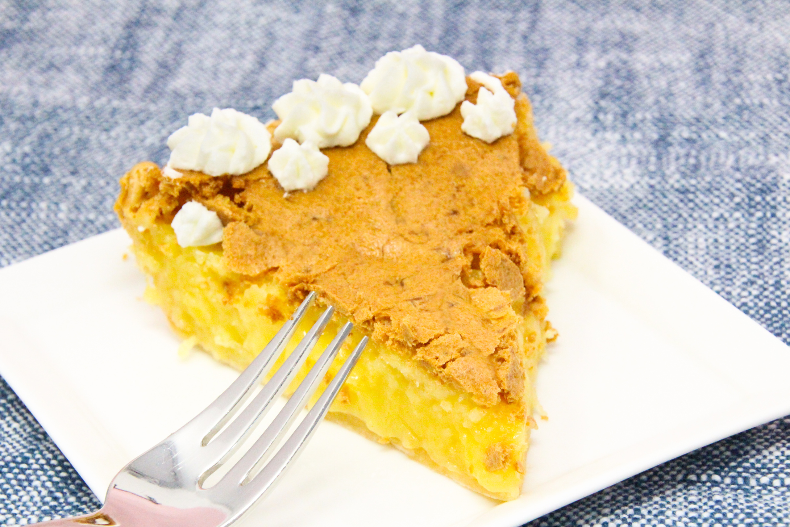 Pineapple Chess Pie is a slightly unexpected spin on the traditional Southern chess pie and a great choice if you're looking for something different from the traditional apple-pumpkin-pecan triumvirate--or in addition to it. Recipe shared with permission granted by Liz Ireland, author of MRS. CLAUS AND THE TROUBLE WITH TURKEYS. 