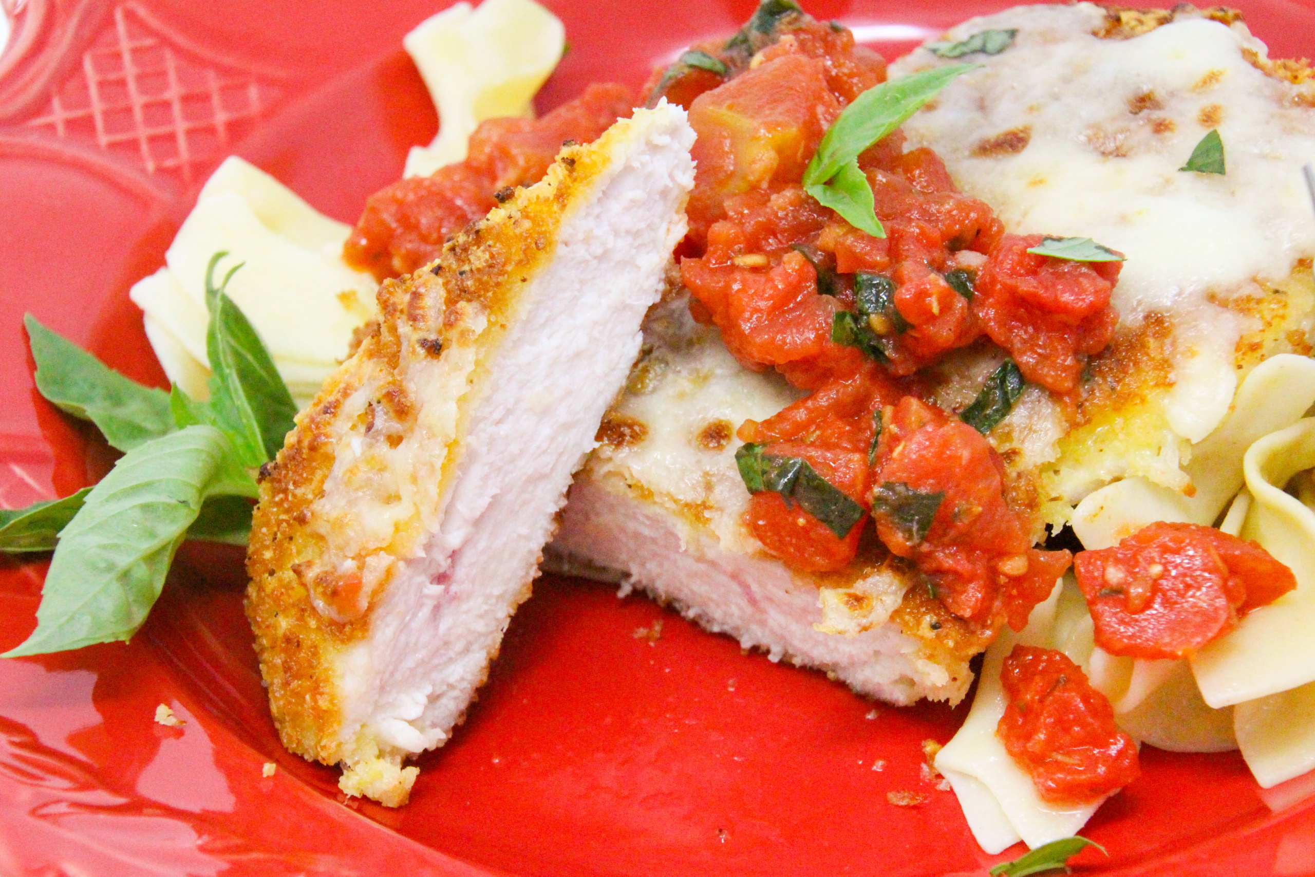 This Chicken Parmesan recipe relies on panko bread crumbs and Parmesan cheese to keep the crust crispy. Topped with melty mozzarella and a simple tomato-basil sauce, this dinner dish will be sure to appeal to the pickiest of eaters. Recipe created by Cinnamon & Sugar. 