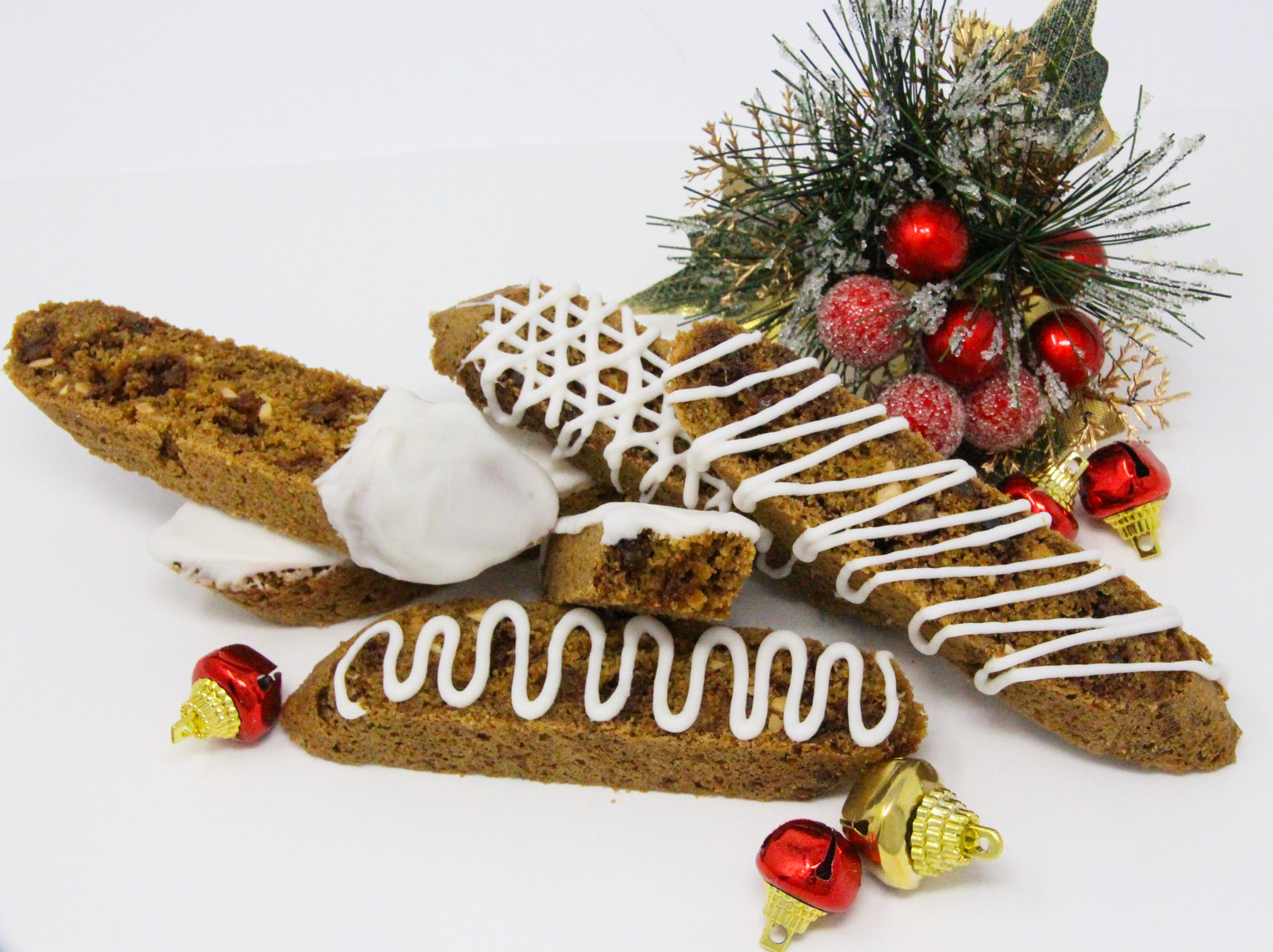 Gluten-free Gingerbread Biscotti are perfectly sweetened and chockful of warming spices and bits of candied ginger. These make the perfect holiday gift for friends and family! Recipe shared with permission granted by Libby Klein, author of SILENT NIGHTS ARE MURDER. 