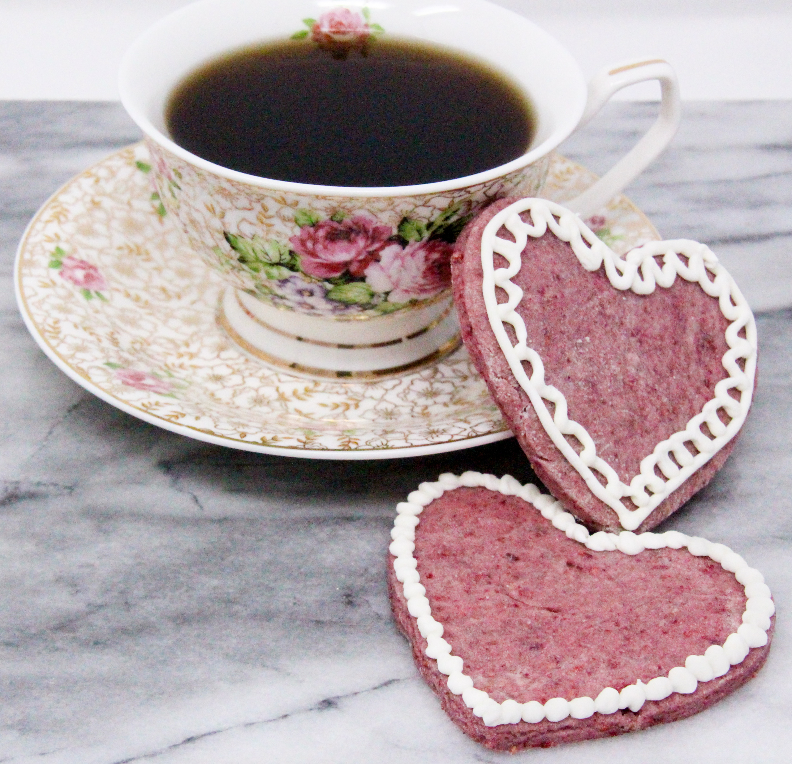 Raspberry Sugar Cookies rely on freeze-dried raspberries to provide a tart sweetness along with a pretty pink color to the cookies, without relying on food coloring. Recipe created by Cinnamon & Sugar for Catherine Bruns, author of CRIMES AND CONFECTIONS.