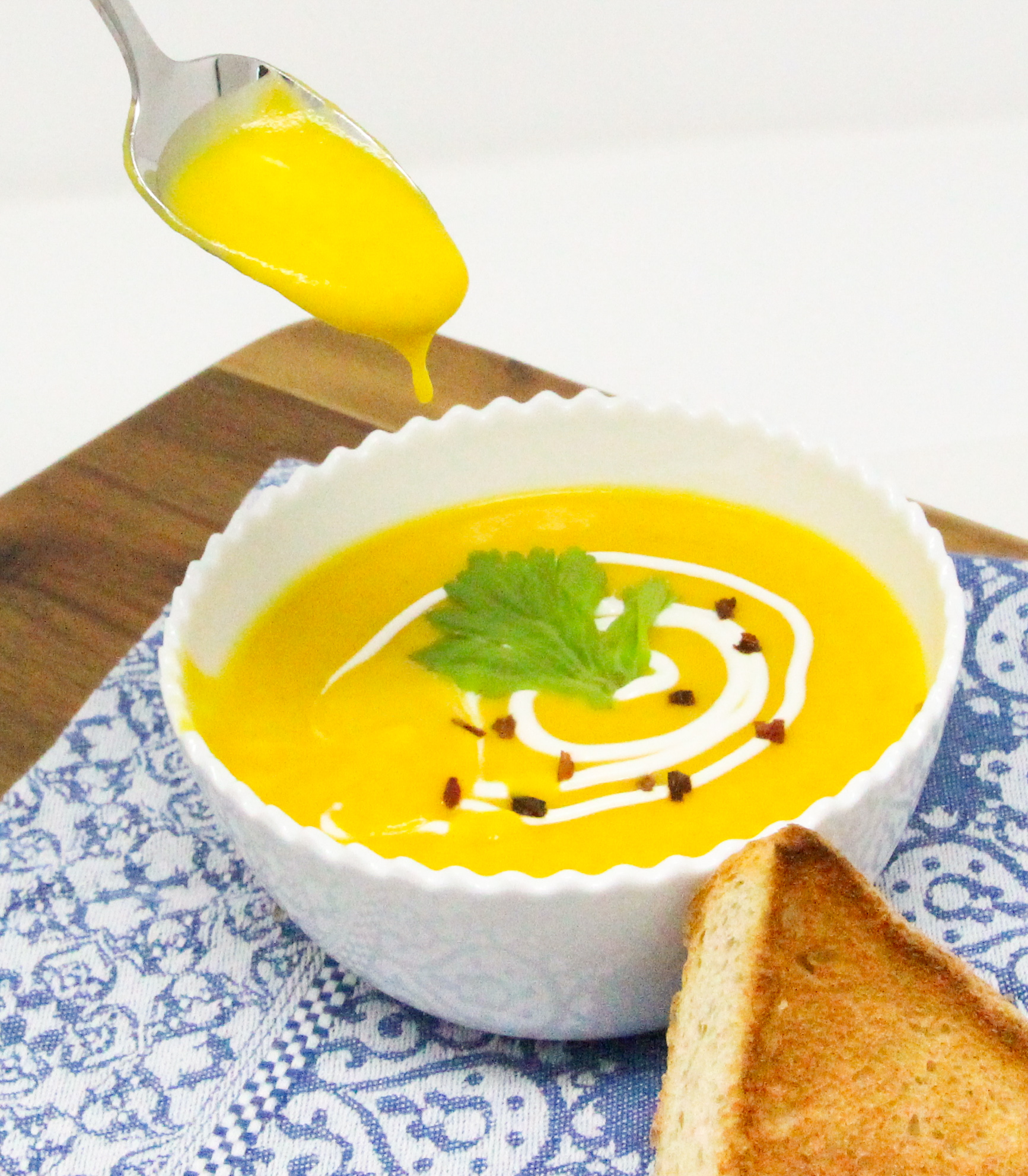 Curried Butternut Squash Soup is chockful of veggies with no added cream or dairy. The soup still tastes creamy and satisfying, with just the right amount of heat thanks to the curry powder and pepper flakes. Recipe shared with permission granted by Vicki Delany, author of A SLAY RIDE TOGETHER WITH YOU. 