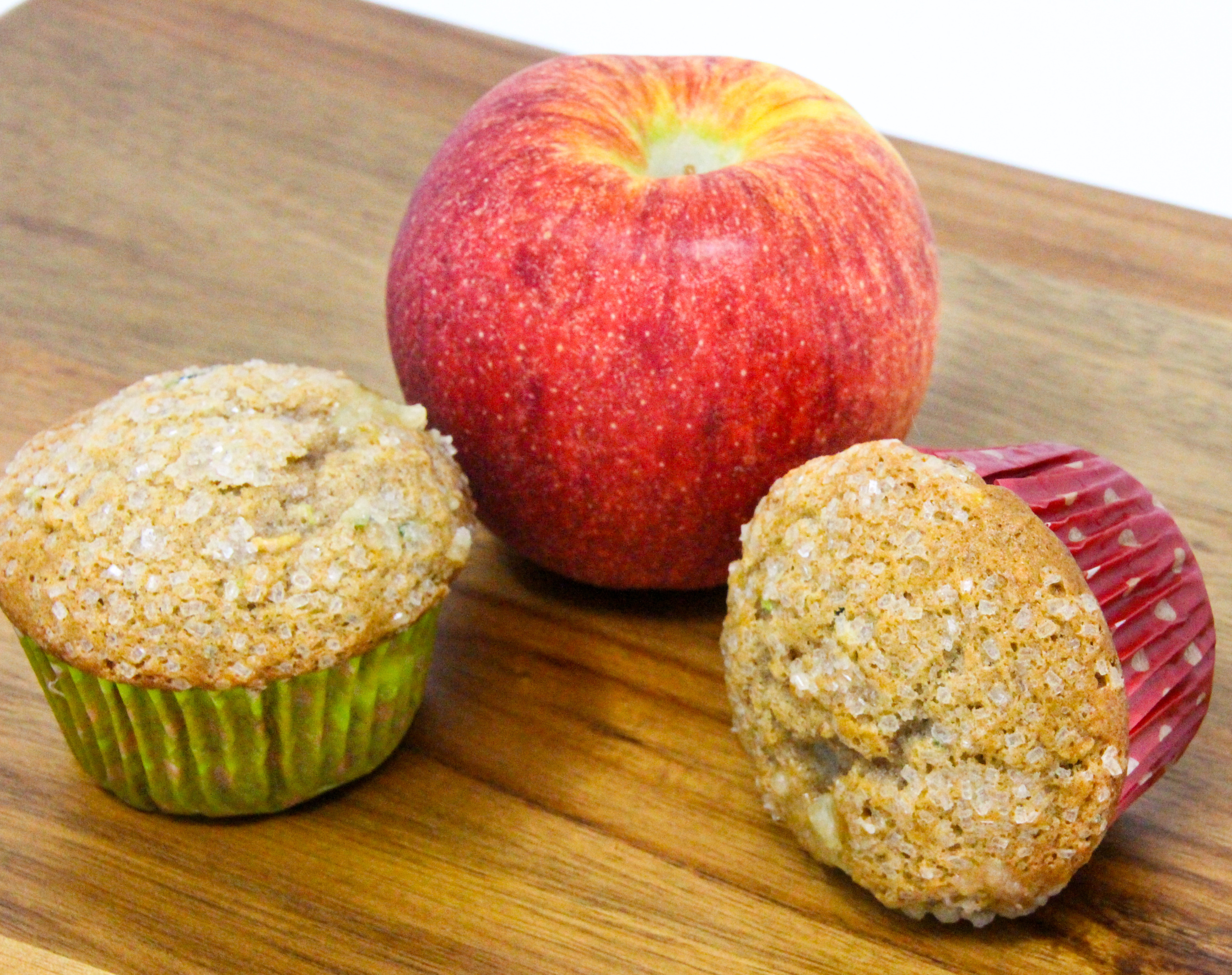 Apple Muffins with an Added Surprise are super moist, thanks to both apple and zucchini used in the batter. The cinnamon adds a nice flavor while the cream cheese filling adds richness. Recipe shared with permission granted by Lois Winston, author of SEAMS LIKE THE PERFECT CRIME.