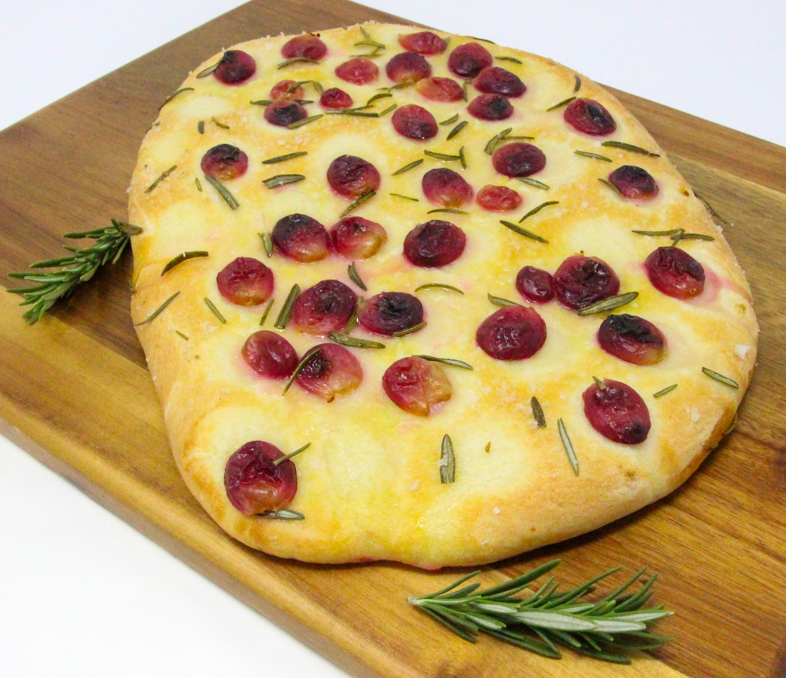 The recipe for Rustic Vineyard Grape and Rosemary Flatbread is shared with permission granted by Daisy Landish, author of WINE & WHISPERS. 