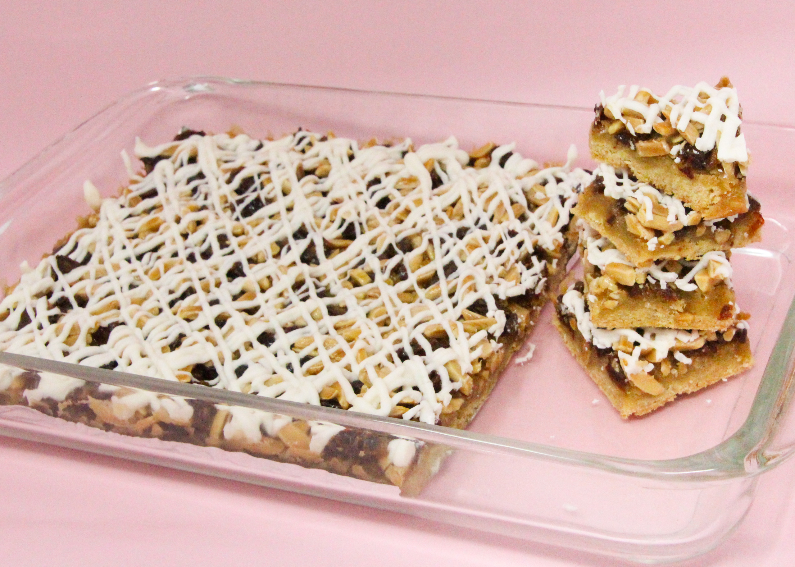 Nutty Almond Date Bars starts with a buttery, almond-flavored crust for the sweet date and crunchy almond filling. With the added white chocolate drizzle, this dessert is pure decadence and you’ll have people clamoring for more! Recipe shared with permission granted by Ellen Byron, author of SOLID GOLD MURDER. 